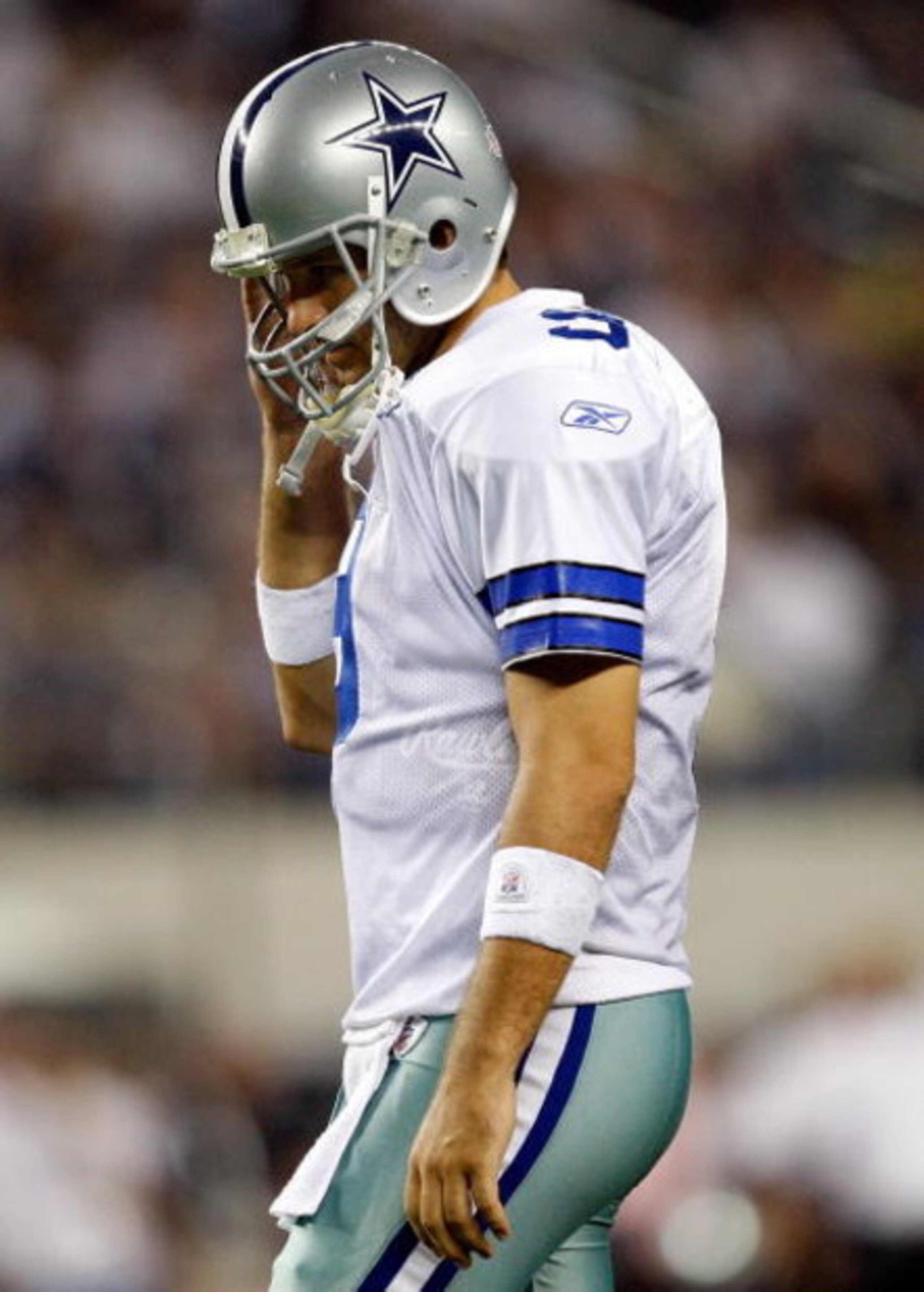 ARLINGTON, TX - SEPTEMBER 20:  Quarterback Tony Romo #9 of the Dallas Cowboys walks off the field during play against the New York Giants at Cowboys Stadium on September 20, 2009 in Arlington, Texas.  (Photo by Ronald Martinez/Getty Images)