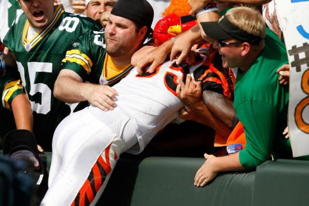 GREEN BAY, WI - SEPTEMBER 20: Wide receiver Chad Ochocinco #85 of the Cincinnati Bengals jumps in the stands to celebrate a touchdown as he does the Lambeau Leap against the Green Bay Packers at Lambeau Field on September 20, 2009 in Green Bay, Wisconsin.