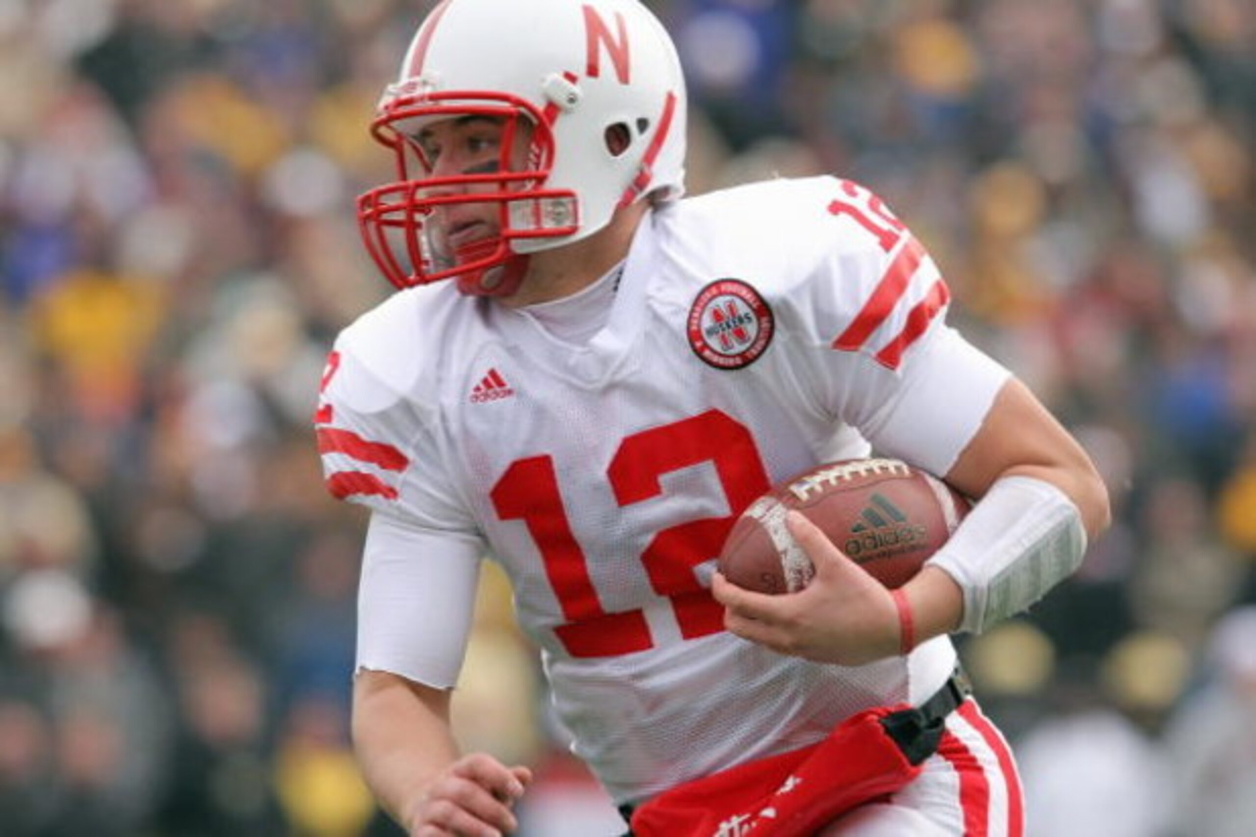 BOULDER, CO - NOVEMBER 23: Joe Ganz #12 of the Nebraska Cornhuskers carries the ball against the Colorado Buffaloes during Big 12 College Football action at Folsom Field on November 23, 2007 in Boulder, Colorado. Colorado defeated Nebraska 65-51. (Photo b BOULDER, CO - NOVEMBER 23: Joe Ganz #12 of the Nebraska Cornhuskers carries the ball against the Colorado Buffaloes during Big 12 College Football action at Folsom Field on November 23, 2007 in Boulder, Colorado. Colorado defeated Nebraska 65-51. (Photo b