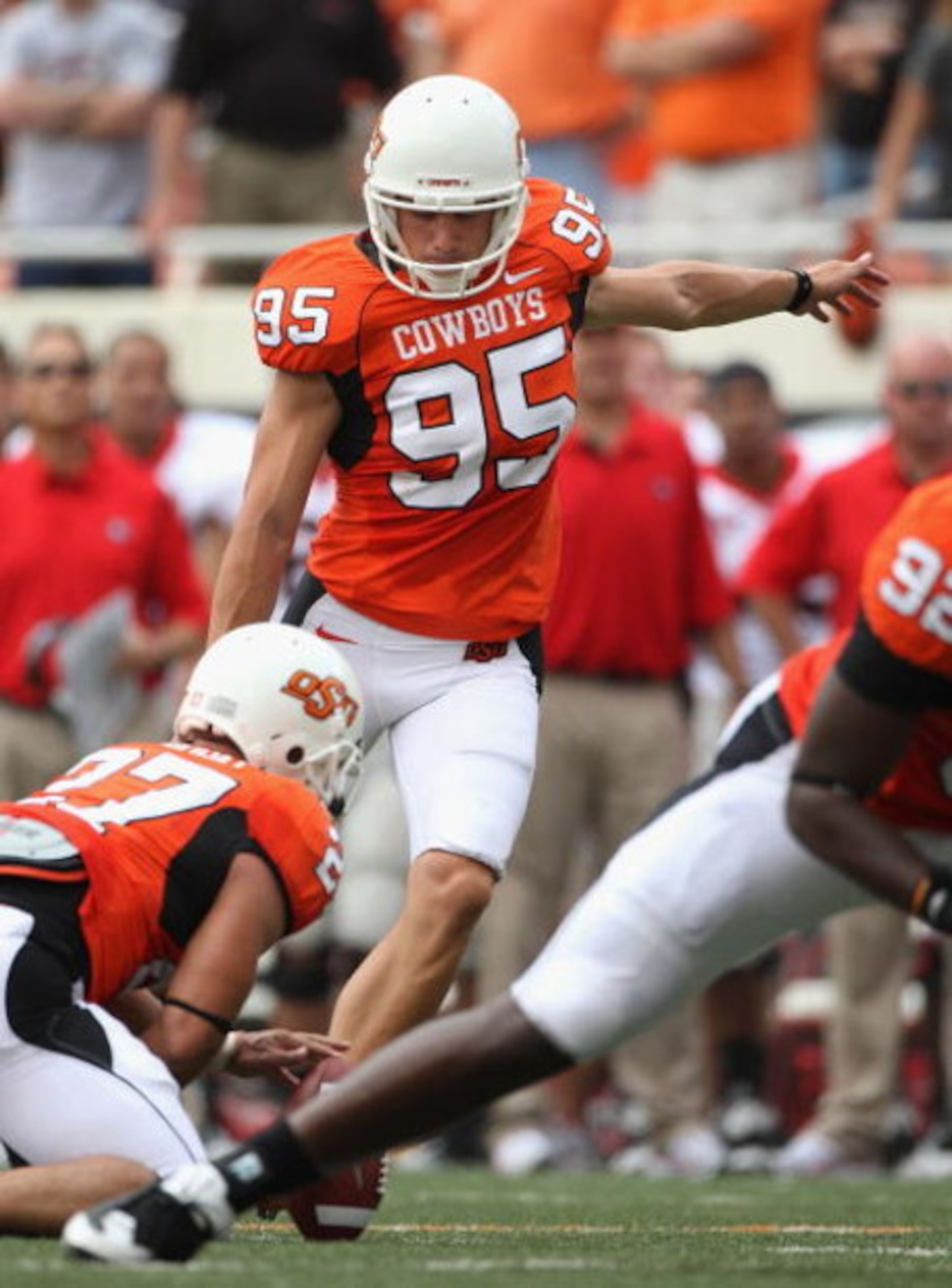 STILLWATER, OK - SEPTEMBER 05: Kicker Dan Bailey #95 of the Oklahoma State Cowboys kicks a field goal during the college football game against the Georgia Bulldogs at Boone Pickens Stadium on September 5, 2009 in Stillwater, Oklahoma. The Cowboys defeat STILLWATER, OK - SEPTEMBER 05: Kicker Dan Bailey #95 of the Oklahoma State Cowboys kicks a field goal during the college football game against the Georgia Bulldogs at Boone Pickens Stadium on September 5, 2009 in Stillwater, Oklahoma. The Cowboys defeat