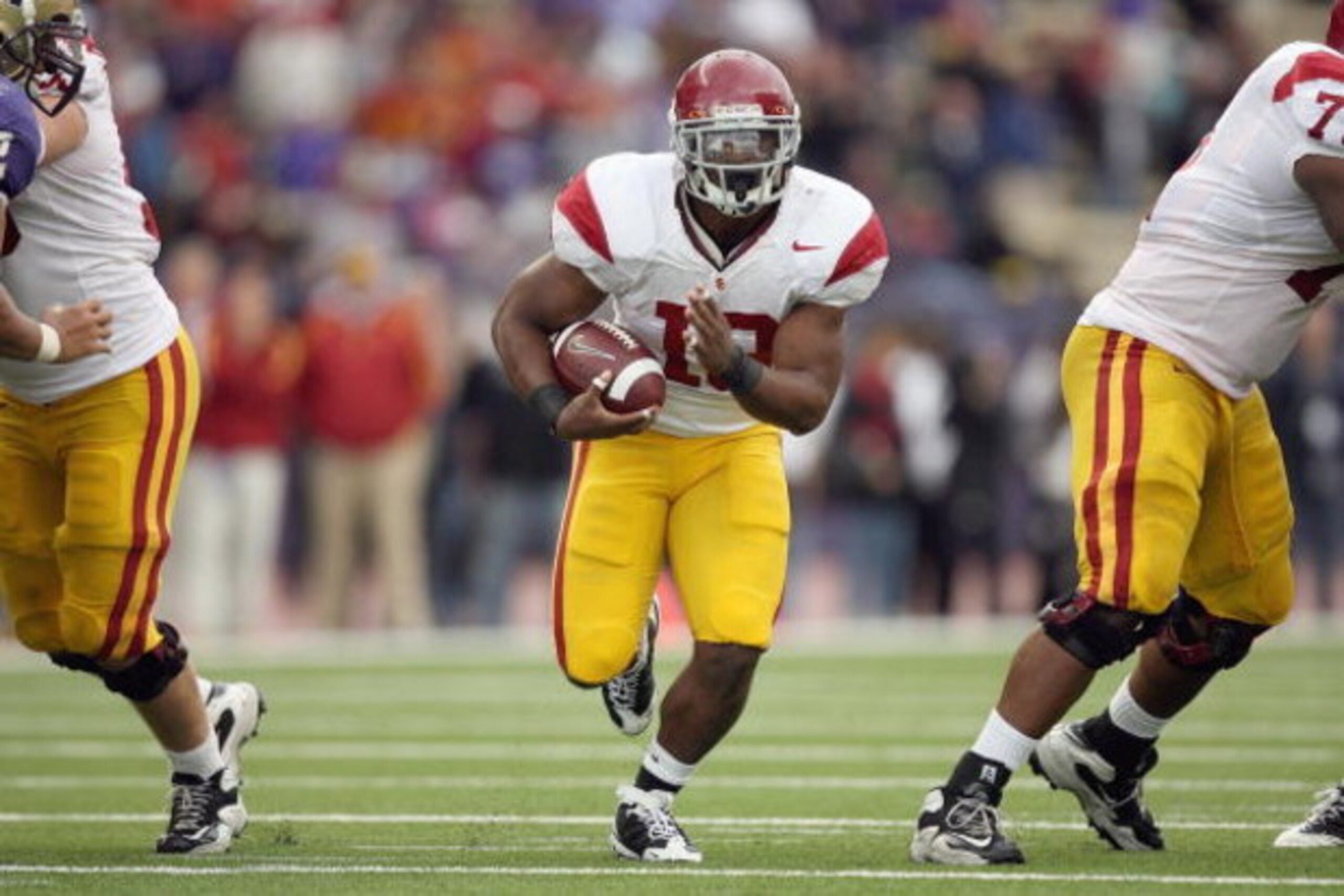 SEATTLE - SEPTEMBER 19: Stafon Johnson #13 of the USC Trojans carries the ball during the game against the Washington Huskies on September 19, 2009 at Husky Stadium in Seattle, Washington. The Huskies defeated the Trojans 16-13. (Photo by Otto Greule Jr/ SEATTLE - SEPTEMBER 19: Stafon Johnson #13 of the USC Trojans carries the ball during the game against the Washington Huskies on September 19, 2009 at Husky Stadium in Seattle, Washington. The Huskies defeated the Trojans 16-13. (Photo by Otto Greule Jr/