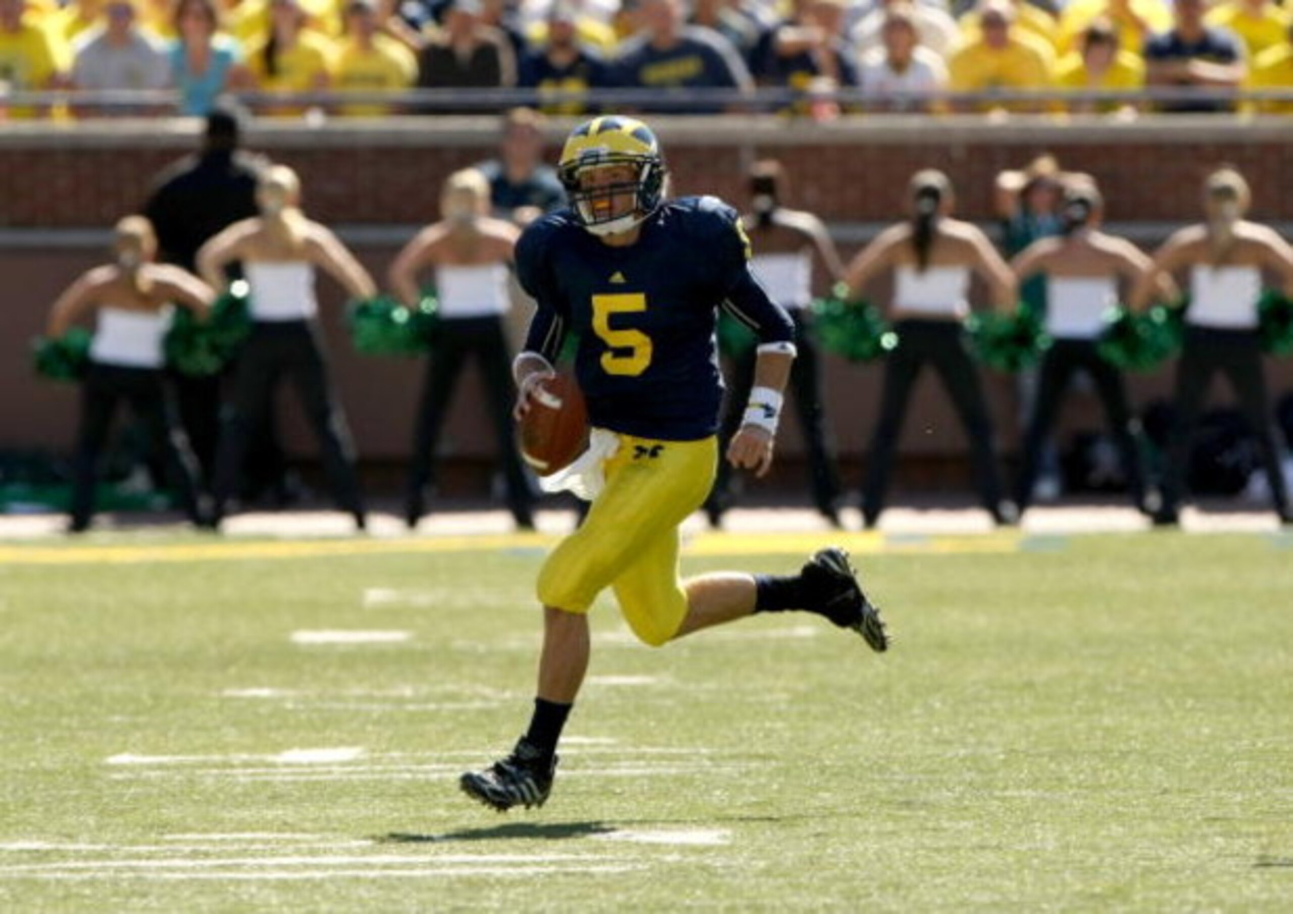 ANN ARBOR, MI - SEPTEMBER 19:  Quarterback Tate Forcier #5 of the Michigan Wolverines carries the ball against the Eastern Michigan Eagles at Michigan Stadium on September 19, 2009 in Ann Arbor, Michigan.   Michigan won 45-17.  (Photo by Stephen Dunn/Gett