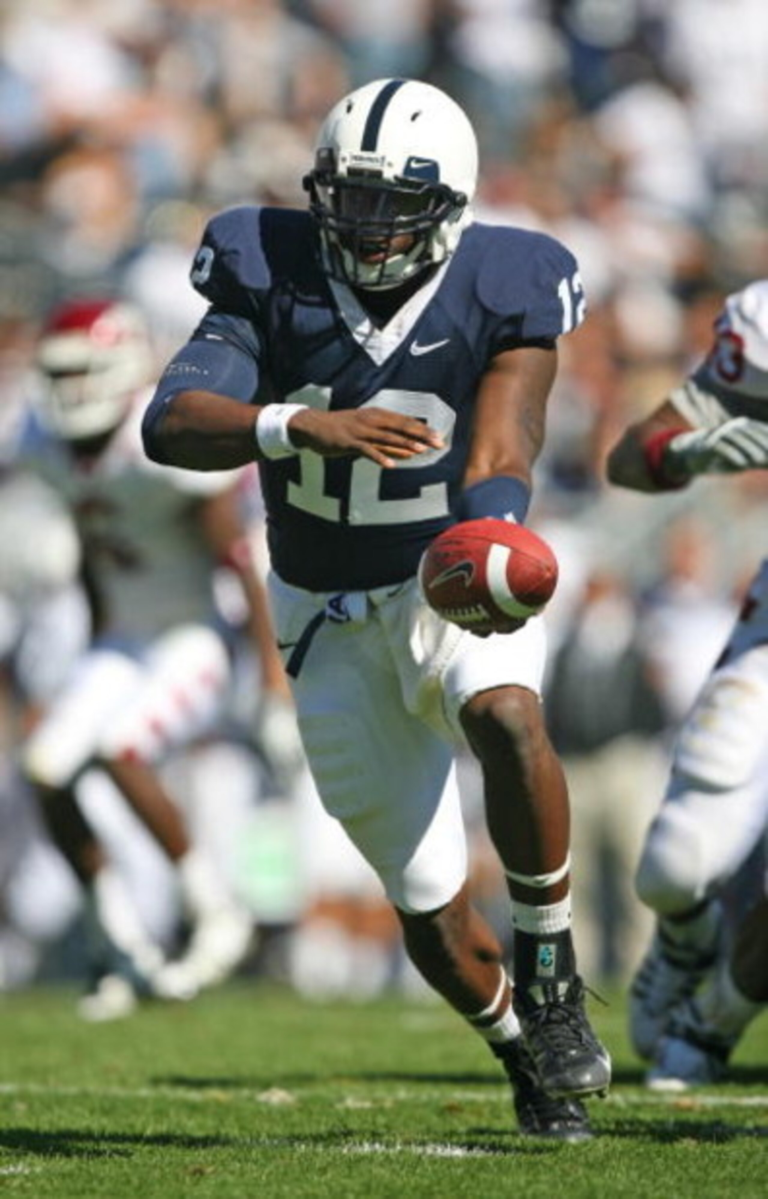 STATE COLLEGE, PA - SEPTEMBER 19: Quarterback Kevin Newsome #12 of the Penn State Nittany Lions hands-off during a game against the Temple Owls on September 19, 2009 at Beaver Stadium in State College, Pennsylvania. (Photo by Hunter Martin/Getty Images) STATE COLLEGE, PA - SEPTEMBER 19: Quarterback Kevin Newsome #12 of the Penn State Nittany Lions hands-off during a game against the Temple Owls on September 19, 2009 at Beaver Stadium in State College, Pennsylvania. (Photo by Hunter Martin/Getty Images)