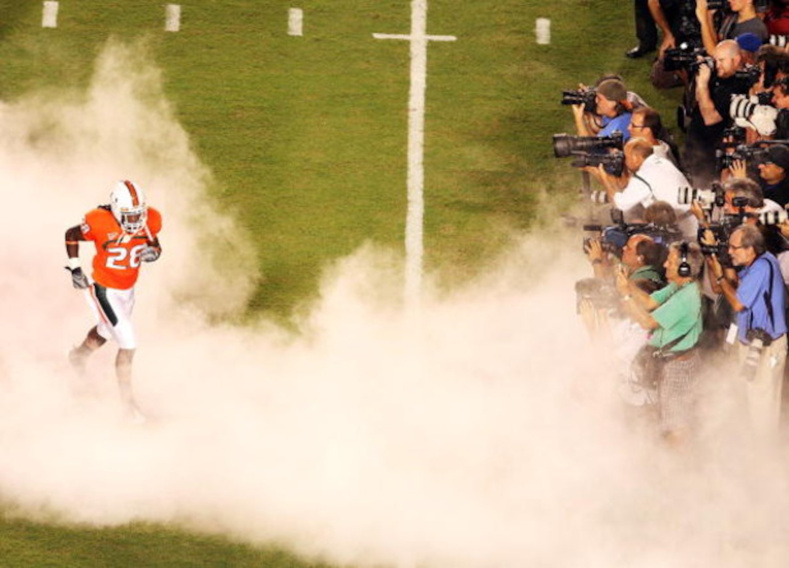 FORT LAUDERDALE, FL - SEPTEMBER 17: Wide receiver Thearon Collier #28 of the Miami Hurricanes runs onto the field past a group of photographers before taking on the Georgia Tech Yellow Jackets at Land Shark Stadium on September 17, 2009 in Fort Lauderdal FORT LAUDERDALE, FL - SEPTEMBER 17: Wide receiver Thearon Collier #28 of the Miami Hurricanes runs onto the field past a group of photographers before taking on the Georgia Tech Yellow Jackets at Land Shark Stadium on September 17, 2009 in Fort Lauderdal