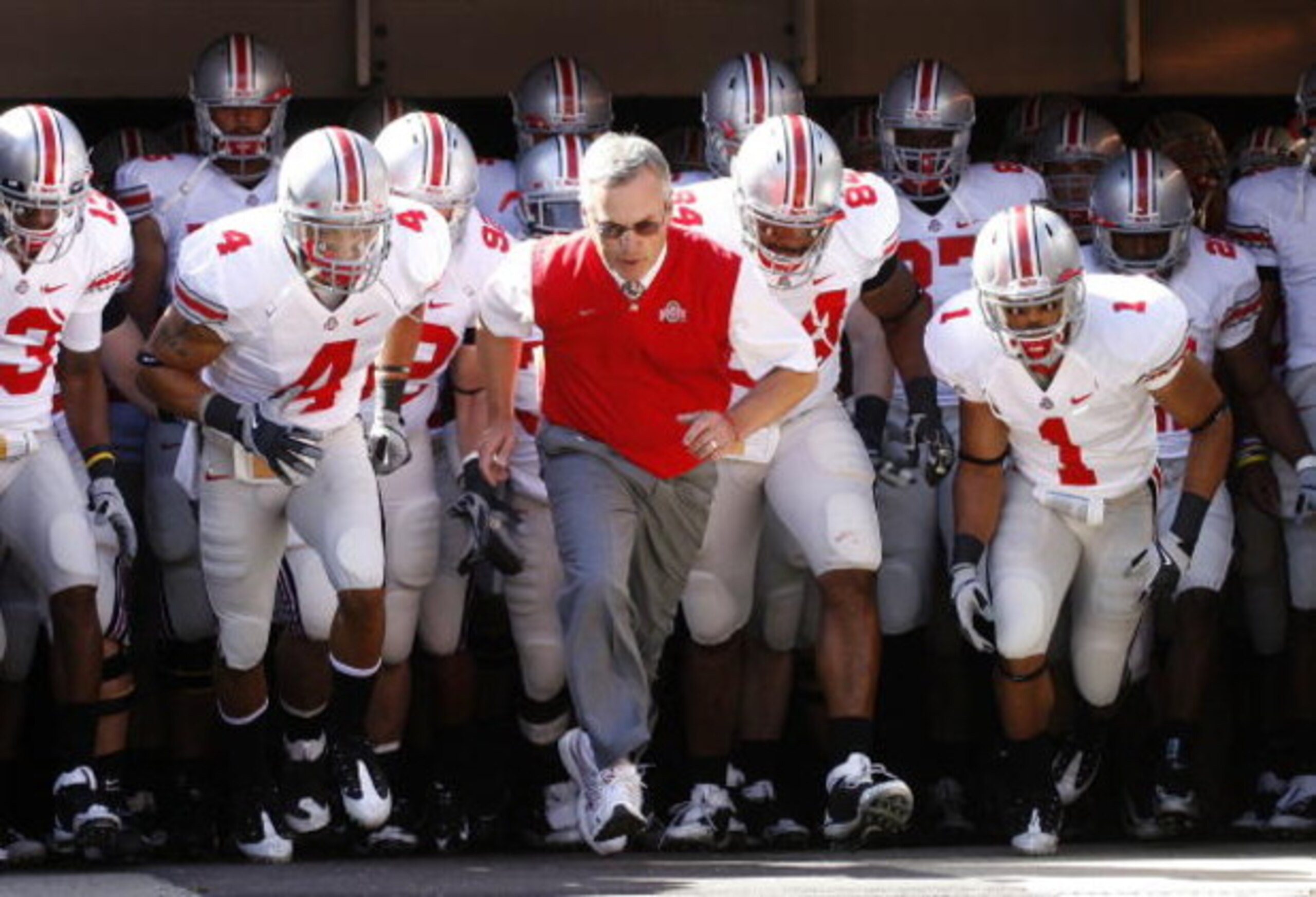 CLEVELAND - SEPTEMBER 19: Head coach Jim Tressel of the Ohio State Buckeyes leads his team onto the field prior to playing the Toledeo Rockets on September 19, 2009 at Cleveland Browns Stadium in Cleveland, Ohio.  (Photo by Gregory Shamus/Getty Images)