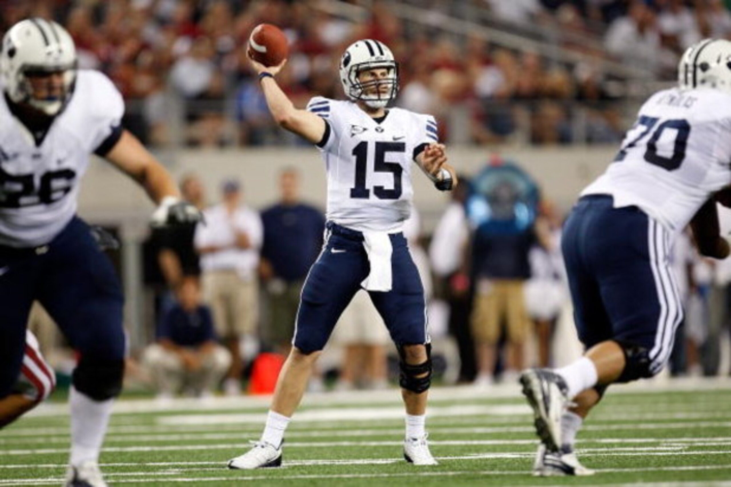 ARLINGTON, TX - SEPTEMBER 05:  Quarterback Max Hall #15 of the Brigham Young Cougars drops back to pass against the Oklahoma Sooners at Cowboys Stadium on September 5, 2009 in Arlington, Texas.  (Photo by Ronald Martinez/Getty Images)