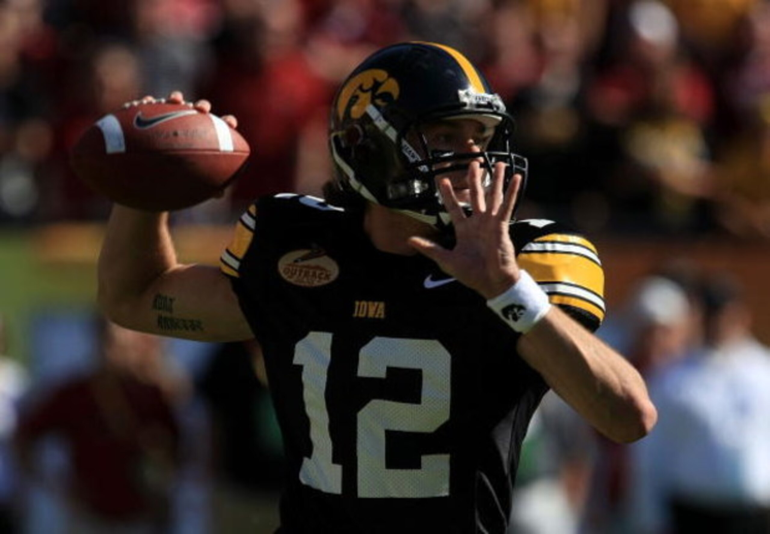 TAMPA, FL - JANUARY 01:  Ricky Stanzi #12 of the Iowa Hawkeyes drops back to pass against the South Carolina Gamecocks during the Outback Bowl on January 1, 2009 at Raymond James Stadium in Tampa, Florida.  (Photo by Scott Halleran/Getty Images)