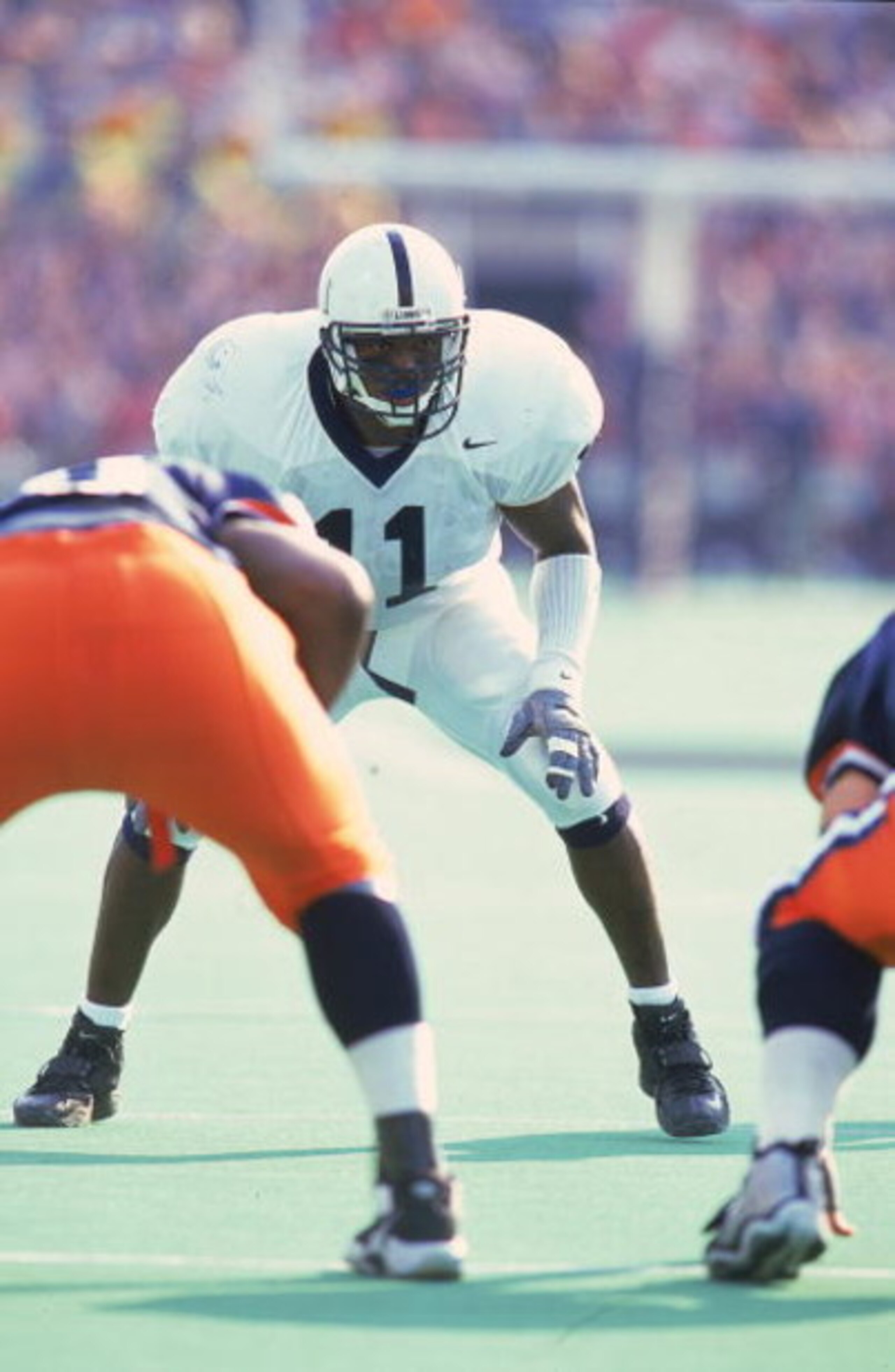 30 Oct 1999: LaVar Arrington #11 of the Penn State Nittany Lions gets ready at the line of scrimmage during the game against the Illinois Fighting Illini at the Memorial Stadium in Champaign, Illinois. The Nittany Lions defeated the Fighting Illini 27-7. 