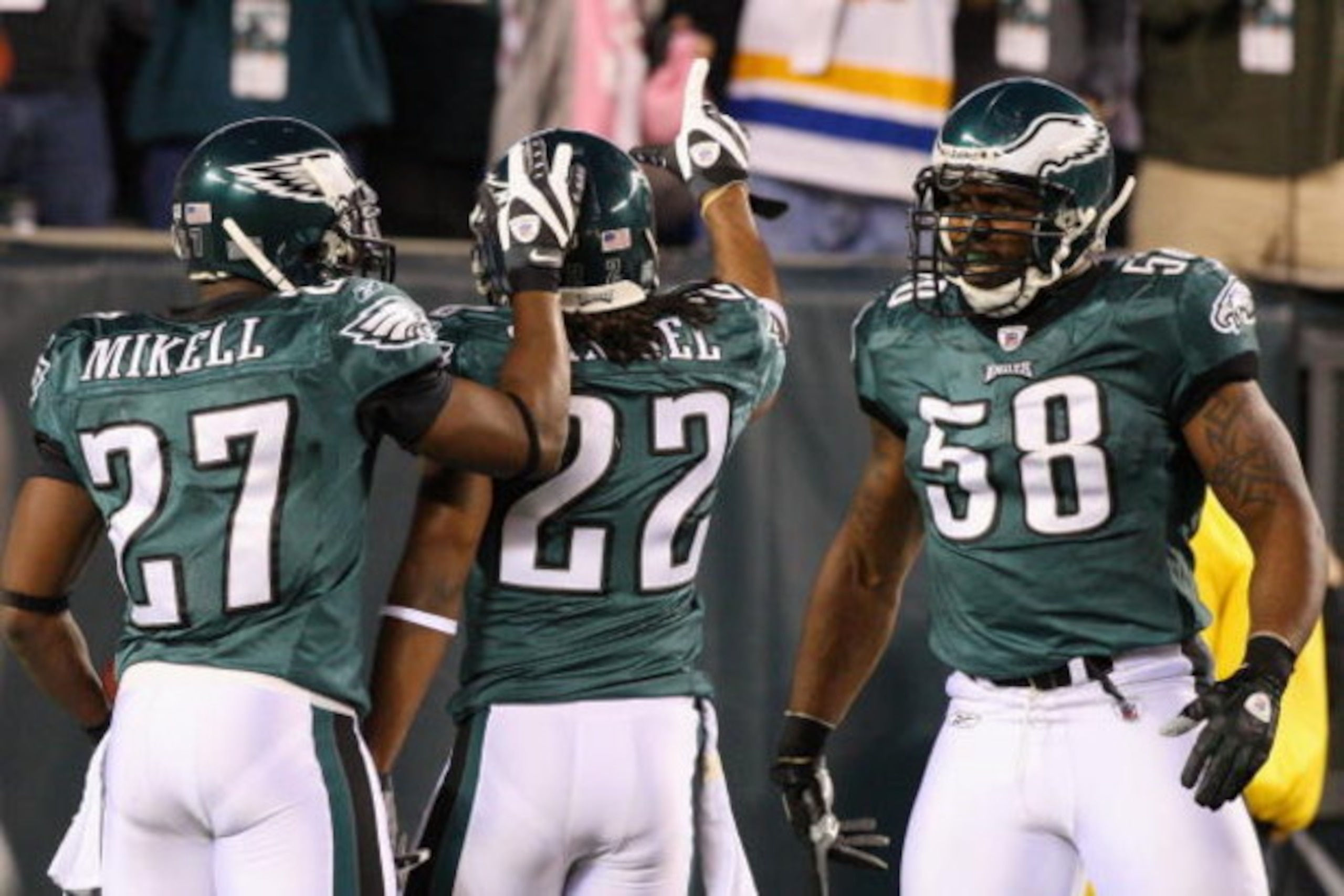 PHILADELPHIA - DECEMBER 15:  Asante Samuel #22 of the Philadelphia Eagles celebrates with Quintin Mikell #27 and Trent Cole #58 after an interception for a touchdown against the Cleveland Browns on December 15, 2008 at Lincoln Financial Field in Philadelp