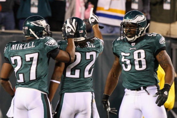 PHILADELPHIA - DECEMBER 15:  Asante Samuel #22 of the Philadelphia Eagles celebrates with Quintin Mikell #27 and Trent Cole #58 after an interception for a touchdown against the Cleveland Browns on December 15, 2008 at Lincoln Financial Field in Philadelp