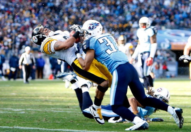 NASHVILLE, TN - DECEMBER 21:  Hines Ward #86 of the Pittsburgh Steelers is hit hard by Cortland Finnegan #31 of the Tennessee Titans as he scores a touchdown during their game on December 21, 2008 at LP Field in Nashville, Tennessee.  (Photo by Streeter L