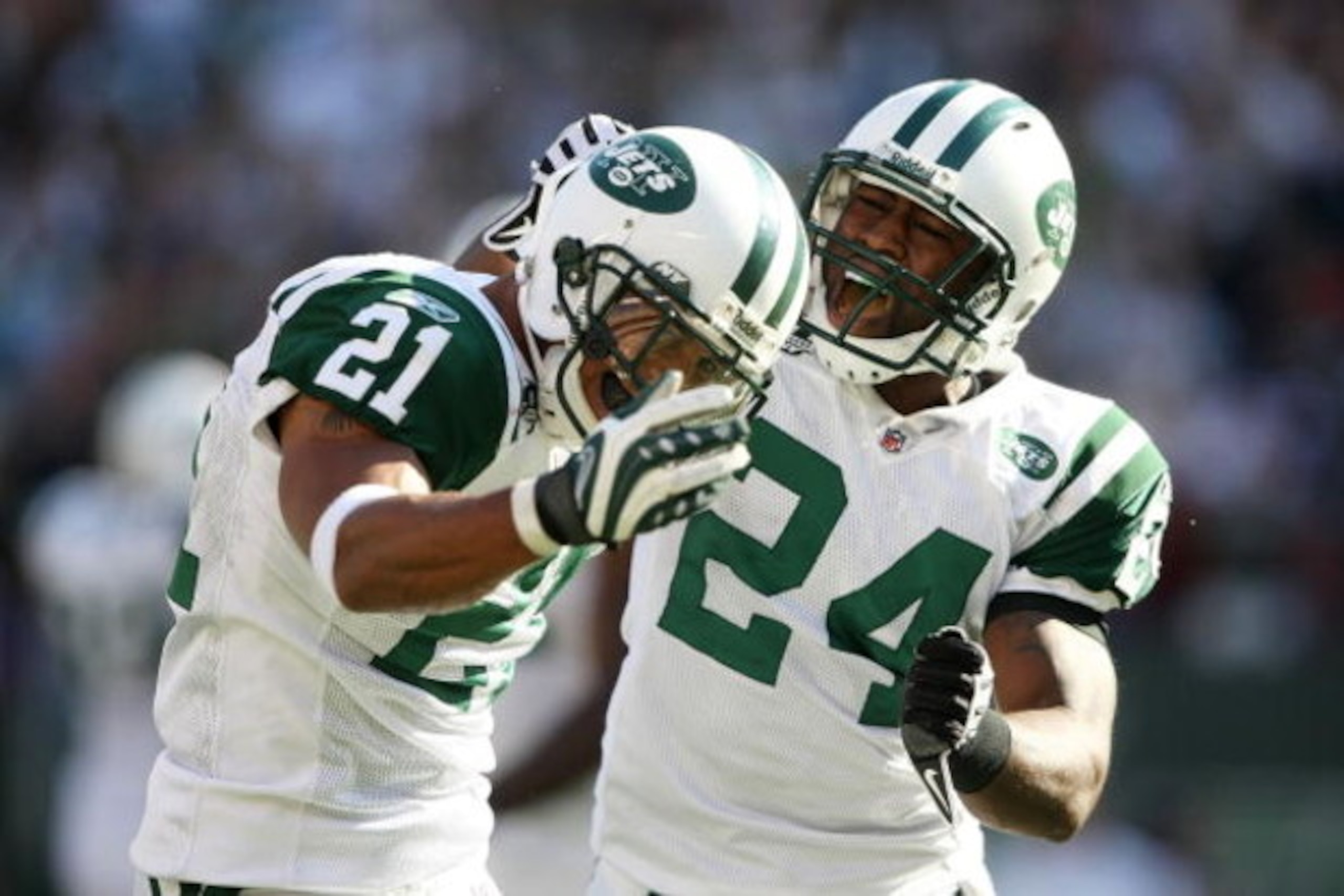EAST RUTHERFORD, NJ - SEPTEMBER 20: Dwight Lowery #21 of the New York Jets celebrates with teammate Darrelle Revis #24 after a turnover against the New England Patriots at Giants Stadium on September 20, 2009 in East Rutherford, New Jersey.  (Photo by Nic