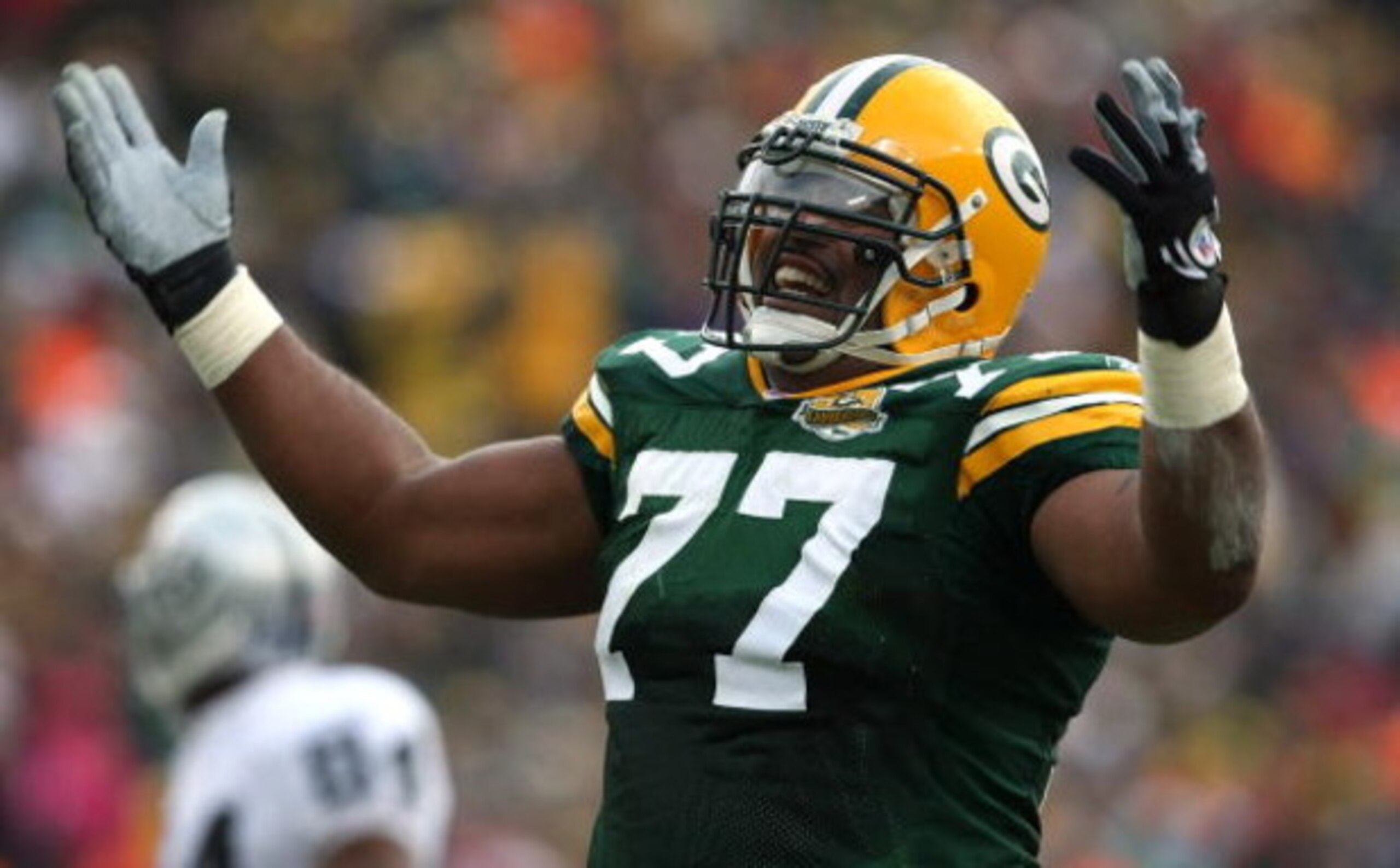 GREEN BAY, WI - DECEMBER 09: Cullen Jenkins #77 of the Green Bay Packers celebrates a tackle for a loss against the Oakland Raiders on December 9, 2007 at Lambeau Field in Green Bay, Wisconsin. The Packers defeated the Raiders 38-7.  (Photo by Jonathan Da