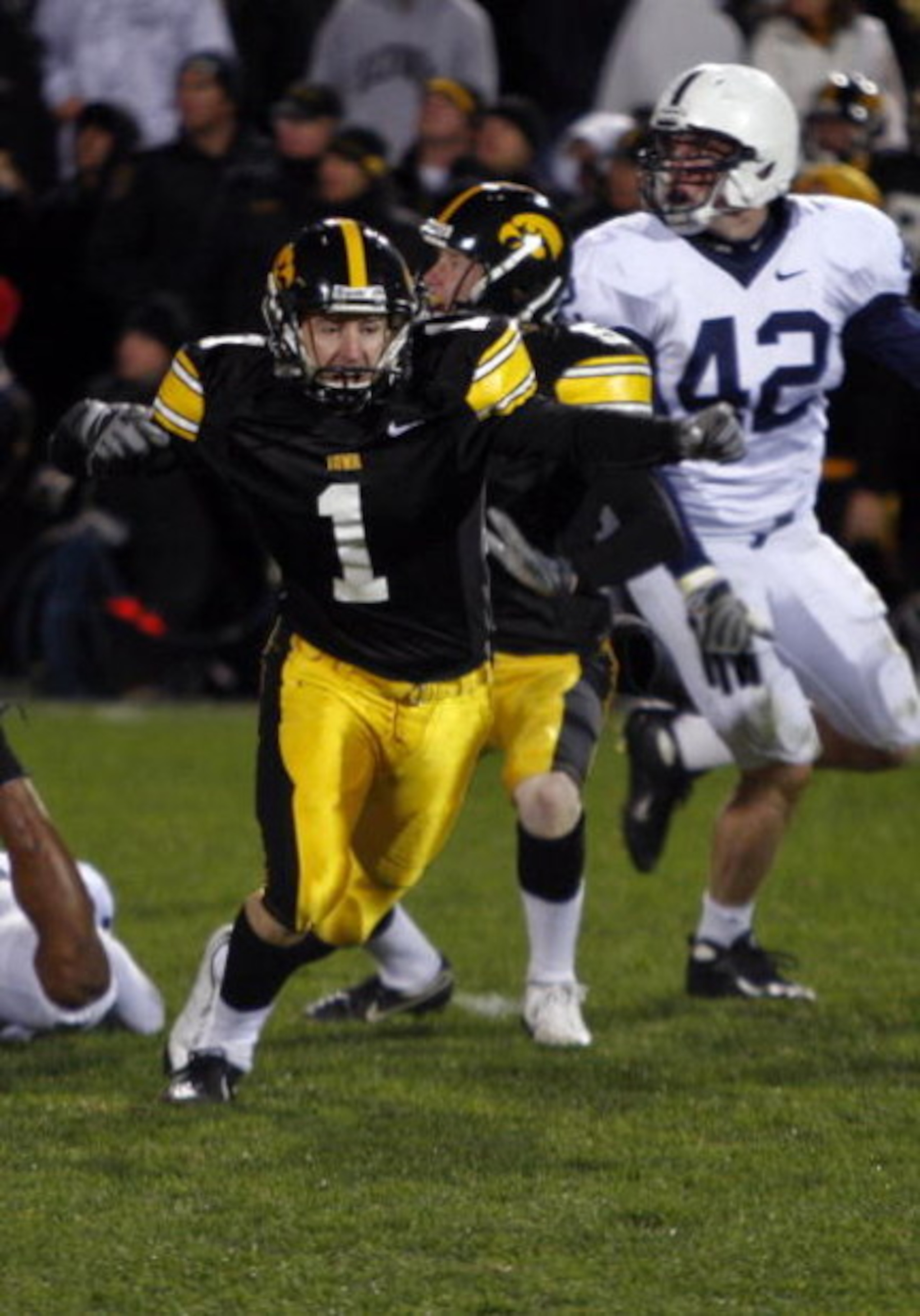 IOWA CITY, IOWA - NOVEMBER 8: Kicker Daniel Murray #1 of the Iowa Hawkeyes celebrates with teammate Ryan Donahue #5 after kicking the game winning field goal defeating Penn State Nittany Lions with six seconds left on the clock at Kinnick Stadium on Novem