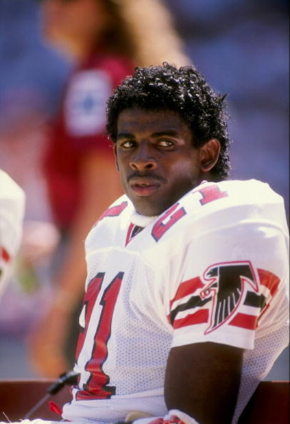 1989-1990:  Defensive back Deion Sanders of the Atlanta Falcons looks on during a game against the Dallas Cowboys at Fulton County Stadium in Atlanta, Georgia.  The Falcons won the game 27-21. Mandatory Credit: Allen Steele  /Allsport