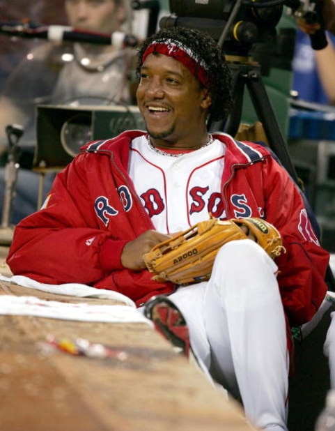 BOSTON - OCTOBER 8:   Pedro Martinez #45 of the Boston Red Sox looks on from the dugout in the seventh inning against the Anaheim Angels in Game 3 of the American League Division Series October 8, 2004 at Fenway Park in Boston, Massachusetts.  (Photo by A