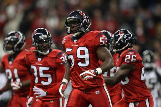 HOUSTON - DECEMBER 01:  DeMeco Ryans #59 of the Houston Texans during play against the Jacksonville Jaguars at Reliant Stadium on December 1, 2008 in Houston, Texas.  (Photo by Ronald Martinez/Getty Images)
