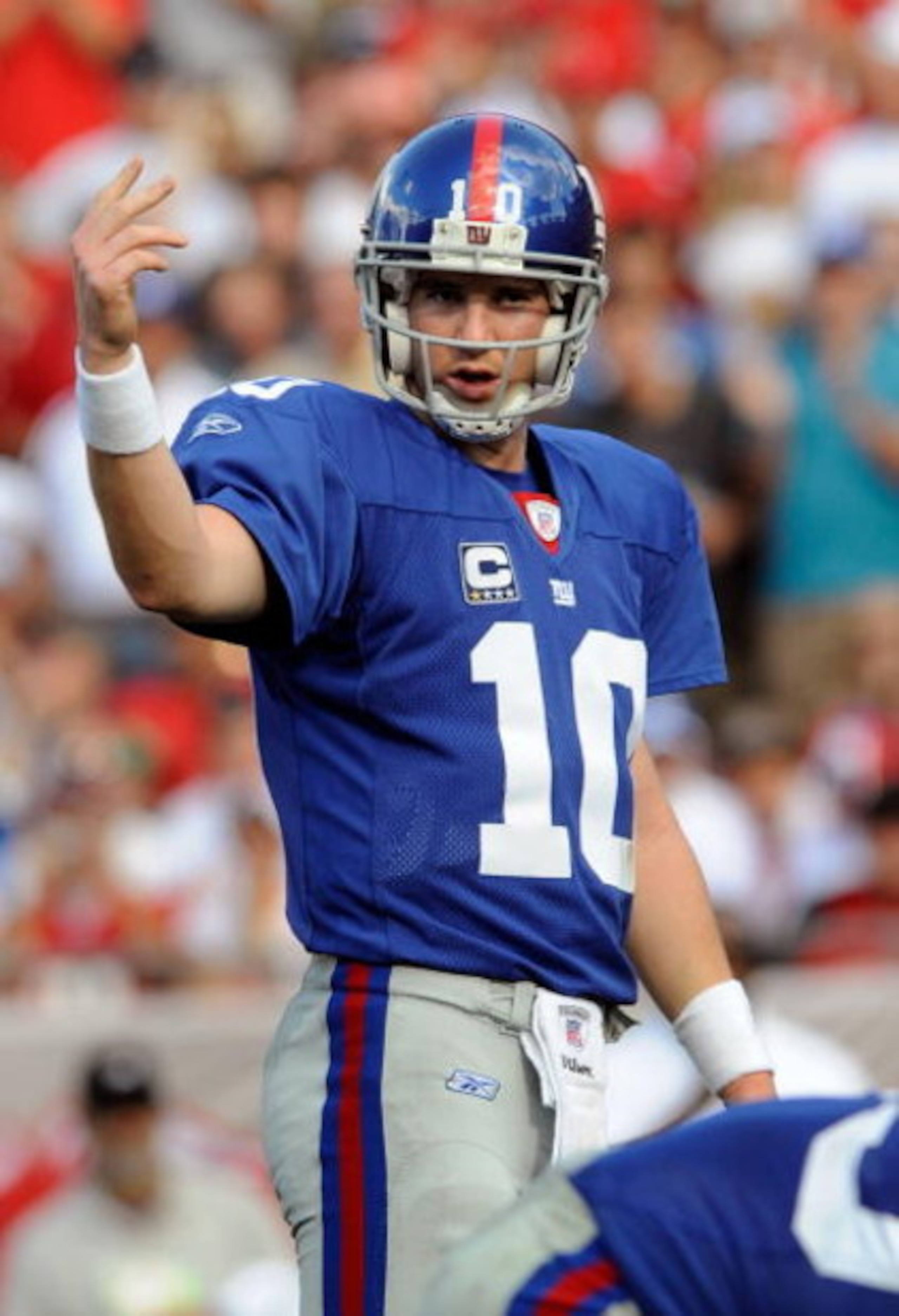 TAMPA, FL - JANUARY 06:  Quarterback Eli Manning #10 of the New York Giants motions to his team during the NFC Wild Card game against Tampa Bay Buccaneers at Raymond James Stadium on January 6, 2008 in Tampa, Florida. The Giants won the game 24-14.  (Phot