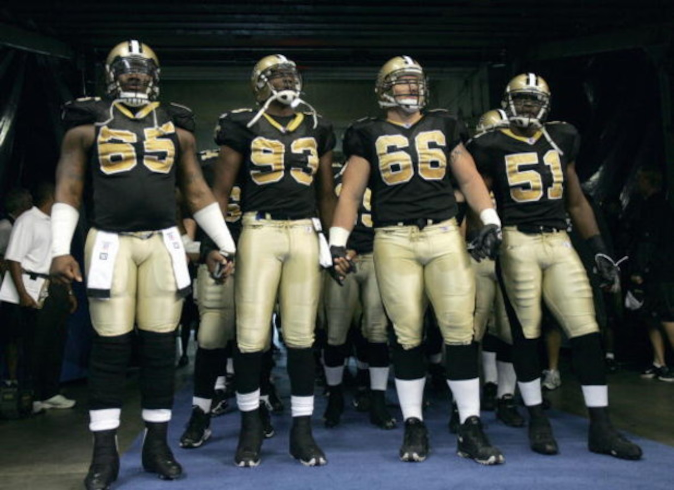 SAN ANTONIO, TX - OCTOBER 2: LeCharles Bentley #65, Brian Young #66, Terrence Melton #51 Darren Howard #93 of the New Orleans Saints get ready to run onto the field before the game against the Buffalo Bills on October 2, 2005 at the Alamodome in San Anton