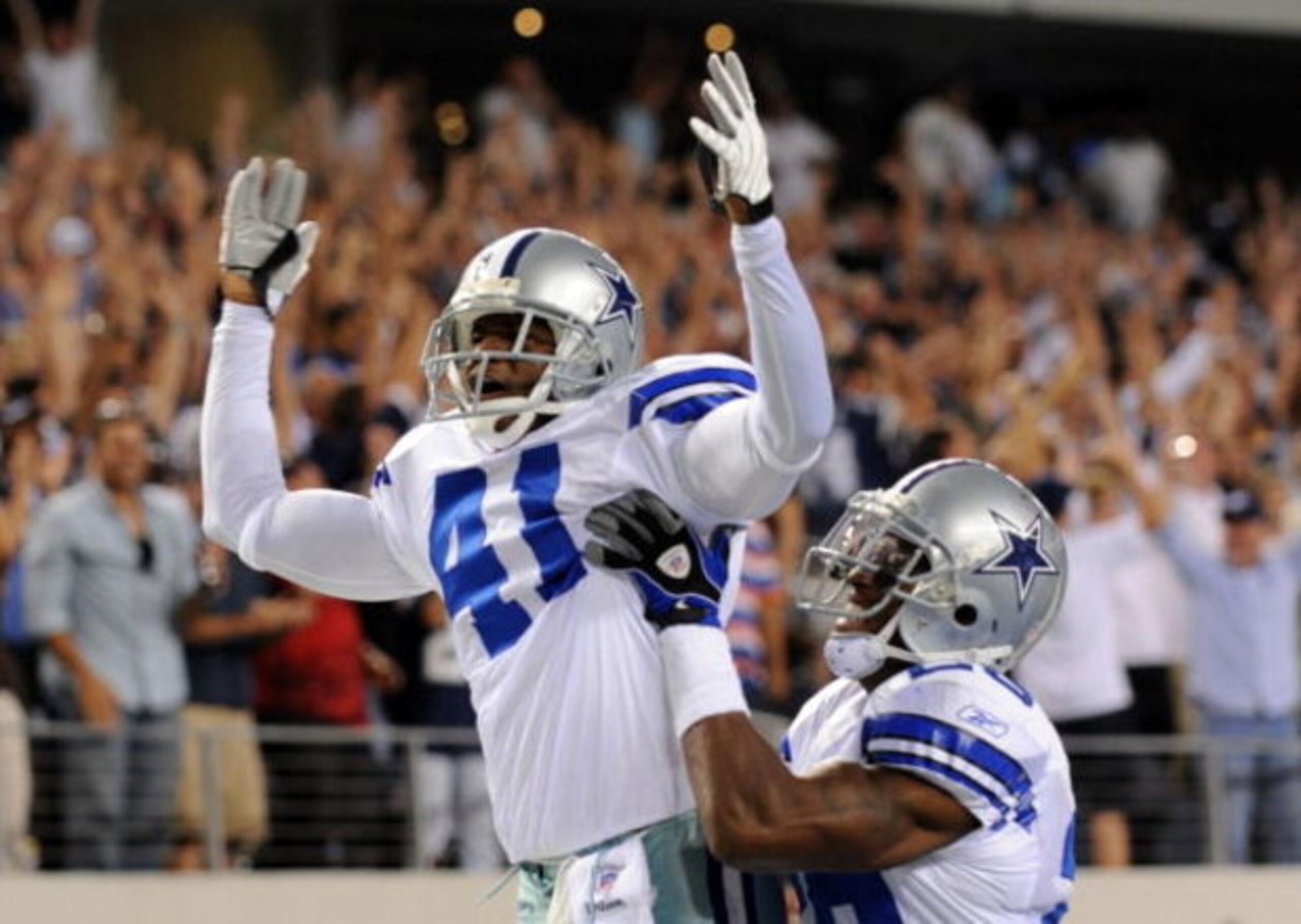 ARLINGTON, TX - SEPTEMBER 28: Terence Newman #41 of the Dallas Cowboys celebrates with teammate Ken Hamlin #26 after returning an interception for a touchdown in the fourth quater against the Carolina Panthers at Cowboys Stadium on September 28, 2009 in ARLINGTON, TX - SEPTEMBER 28: Terence Newman #41 of the Dallas Cowboys celebrates with teammate Ken Hamlin #26 after returning an interception for a touchdown in the fourth quater against the Carolina Panthers at Cowboys Stadium on September 28, 2009 in