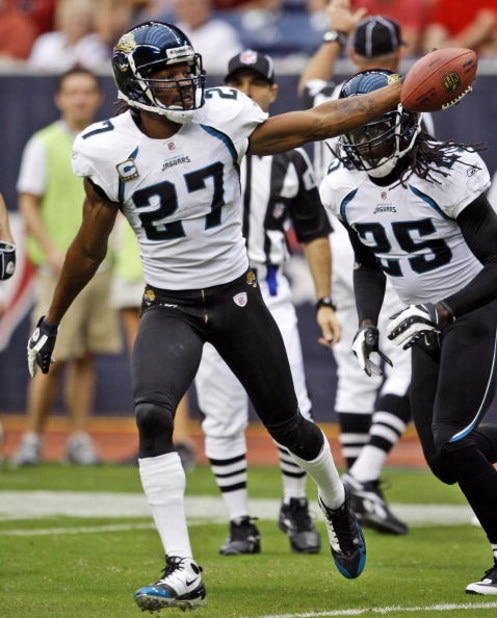 HOUSTON - SEPTEMBER 27:  Cornerback Rasheem Mathis #27 of the Jacksonville Jaguars celebrates with safety Reggie Nelson after intercepting a pass meant for  wide receiver Andre Johnson #80 of the Houston Texans at Reliant Stadium on September 27, 2009 in 