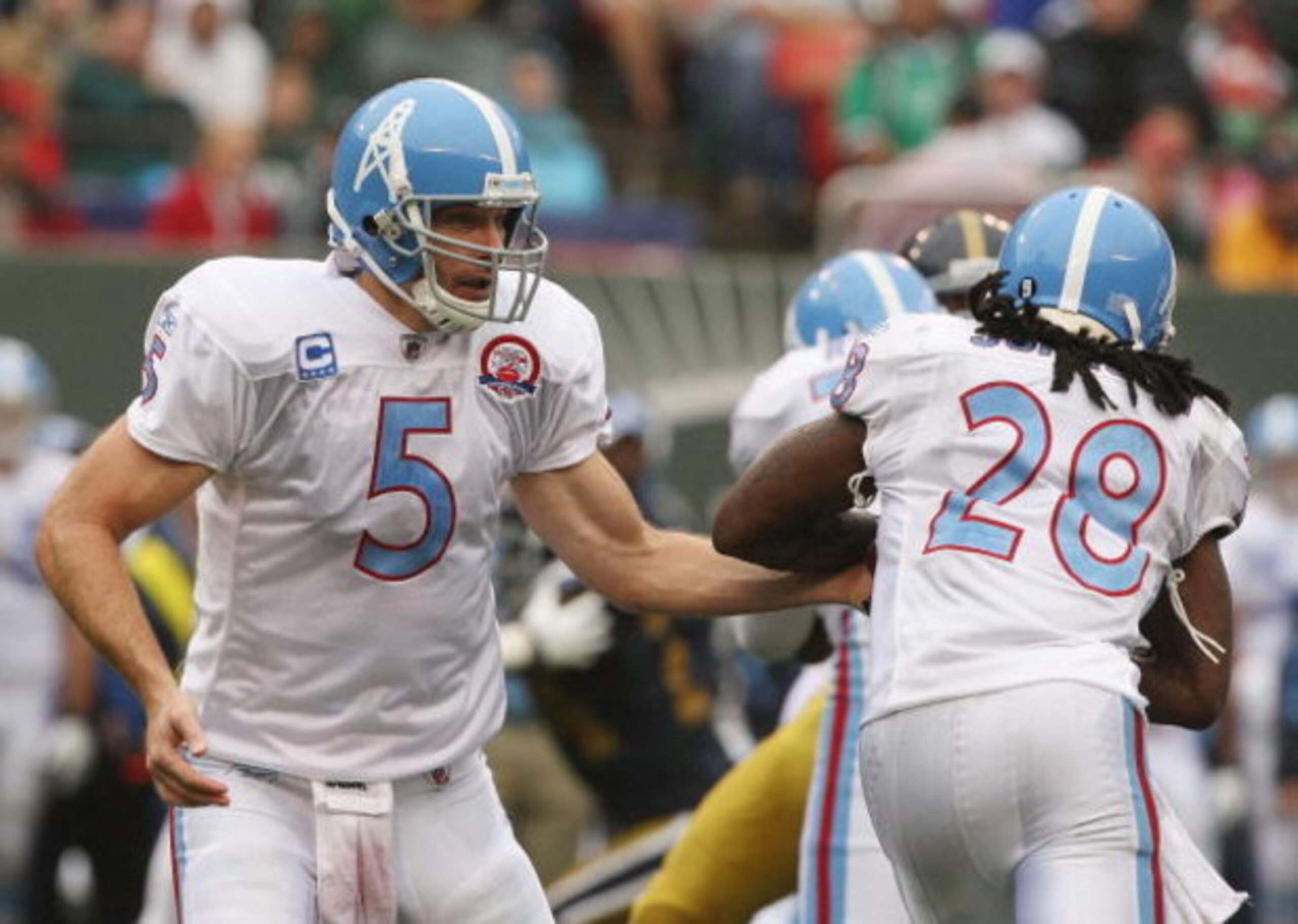 EAST RUTHERFORD, NJ - SEPTEMBER 27: Kerry Collins #5 hands off to Chris Johnson #28 of The Tennessee Titans in action against the New York Jets during their game on September 27, 2009 at Giants Stadium in East Rutherford, New Jersey. (Photo by Al Bello/ EAST RUTHERFORD, NJ - SEPTEMBER 27: Kerry Collins #5 hands off to Chris Johnson #28 of The Tennessee Titans in action against the New York Jets during their game on September 27, 2009 at Giants Stadium in East Rutherford, New Jersey. (Photo by Al Bello/
