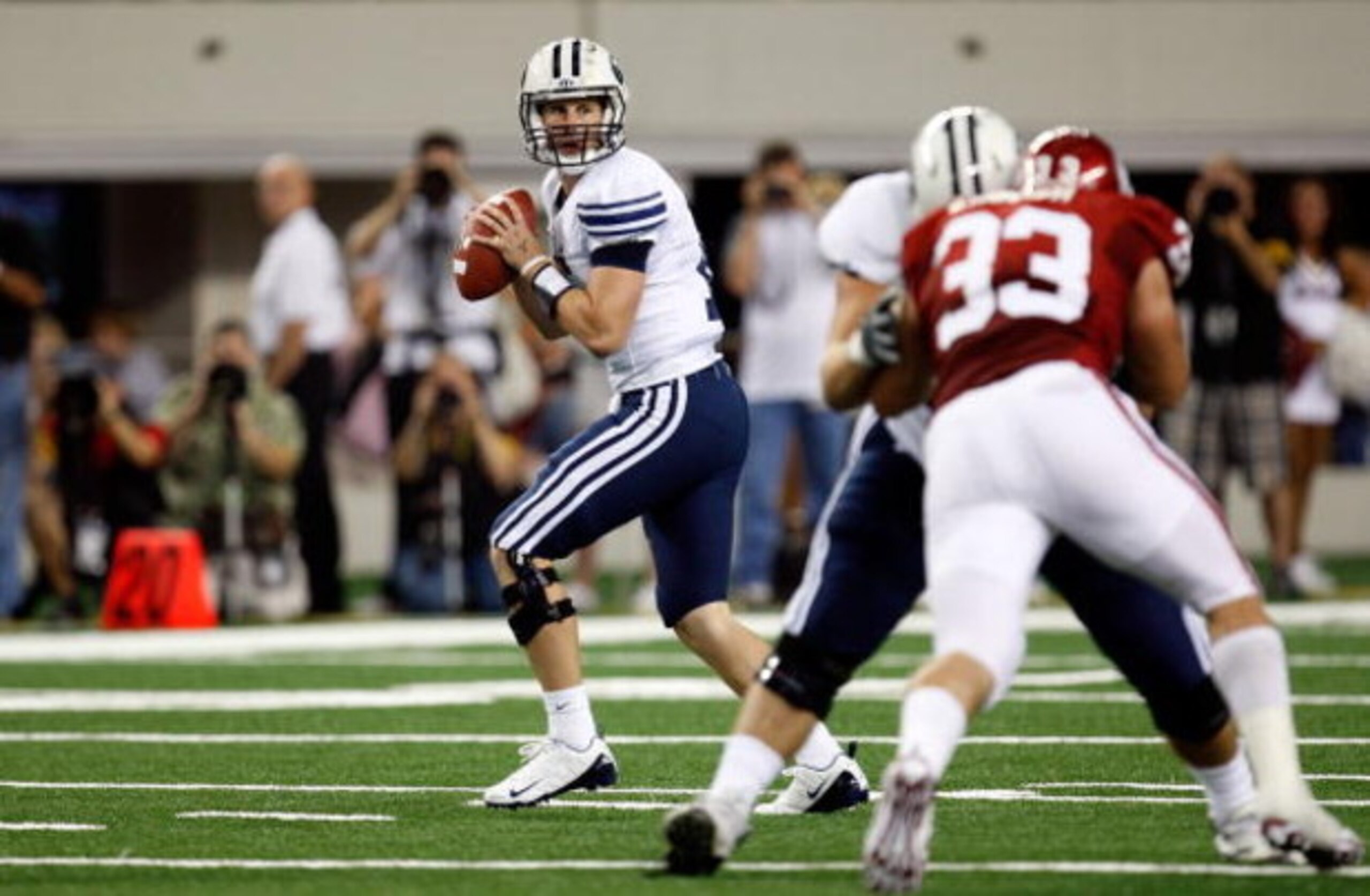 ARLINGTON, TX - SEPTEMBER 05:  Quarterback Max Hall #15 of the Brigham Young Cougars drops back to pass against the Oklahoma Sooners at Cowboys Stadium on September 5, 2009 in Arlington, Texas.  (Photo by Ronald Martinez/Getty Images)