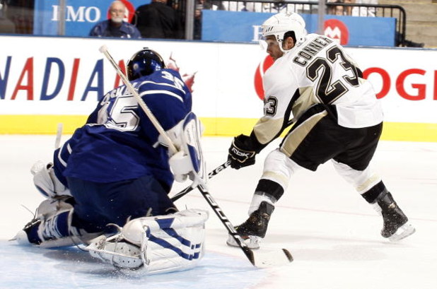 TORONTO - SEPTEMBER 22:  Chris Conner #23 of the Pittsburgh Penguins scores on goalie Vesa Toskala #35 of the Toronto Maple Leafs during a pre-season  NHL game at the Air Canada Centre on September 22, 2009 in Toronto, Ontario, Canada .  (Photo by Abelima