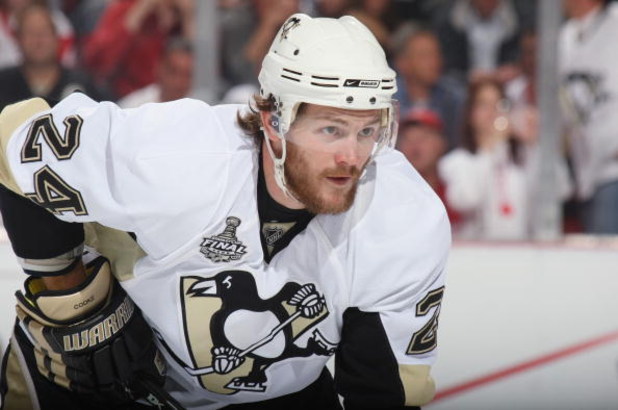 DETROIT - JUNE 6:  Matt Cooke #24 of the Pittsburgh Penguins gets set for a face off against the Detroit Red Wings during Game Five of the 2009 NHL Stanley Cup Finals at Joe Louis Arena on June 6, 2009 in Detroit, Michigan. (Photo by: Bruce Bennett/Getty 