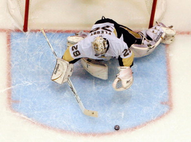DETROIT - JUNE 12:  Marc-Andre Fleury #29 of the Pittsburgh Penguins makes a save against the Detroit Red Wings during Game Seven of the 2009 NHL Stanley Cup Finals at Joe Louis Arena on June 12, 2009 in Detroit, Michigan.  (Photo by Jim McIsaac/Getty Ima