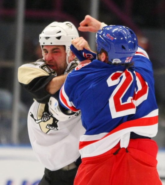 NEW YORK - DECEMBER 03: Eric Godard #28 of the Pittsburgh Penguins and Colton Orr #28 of the New York Rangers exchange first period punches on December 3, 2008 at Madison Square Garden in New York City. (Photo by Bruce Bennett/Getty Images)