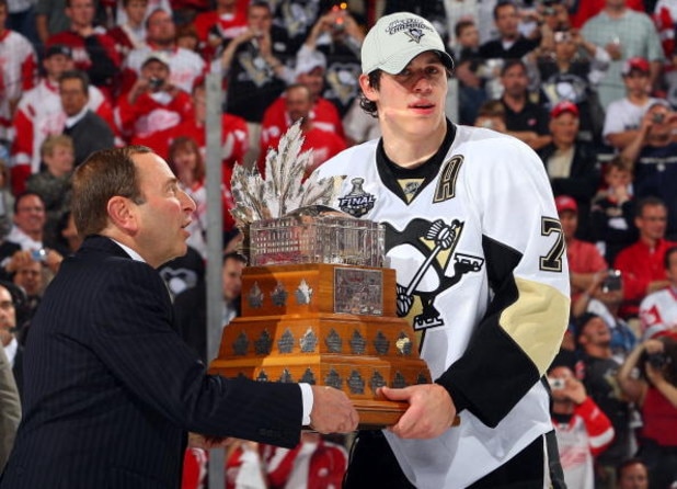 DETROIT - JUNE 12:  NHL commissioner Gary Bettman presents the Conn Smythe trophy to Evgeni Malkin #71 of the Pittsburgh Penguins after defeating the Detroit Red Wings in Game Seven of the 2009 NHL Stanley Cup Finals at Joe Louis Arena on June 12, 2009 in