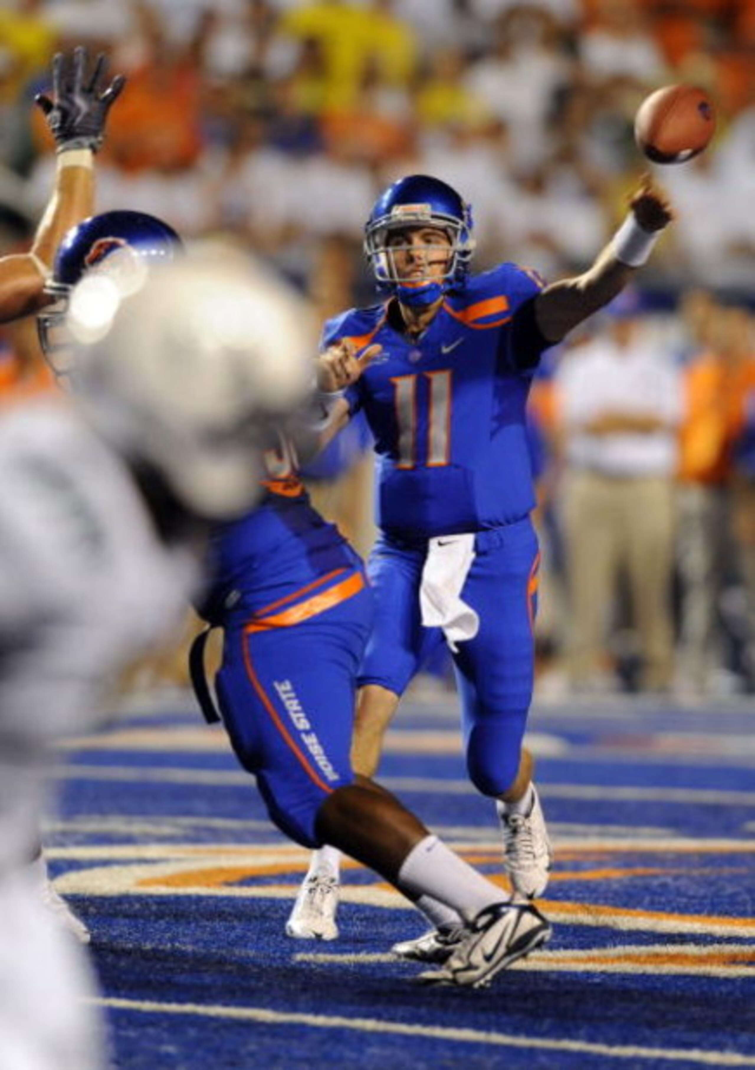 BOISE, ID - SEPTEMBER 3:  Kellen Moore #11 of Boise State throws a pass against the Oregon Ducks in first quarter of the game on September 3, 2009 at Broncos Stadium in Boise, Idaho. (Photo by Steve Dykes/Getty Images)
