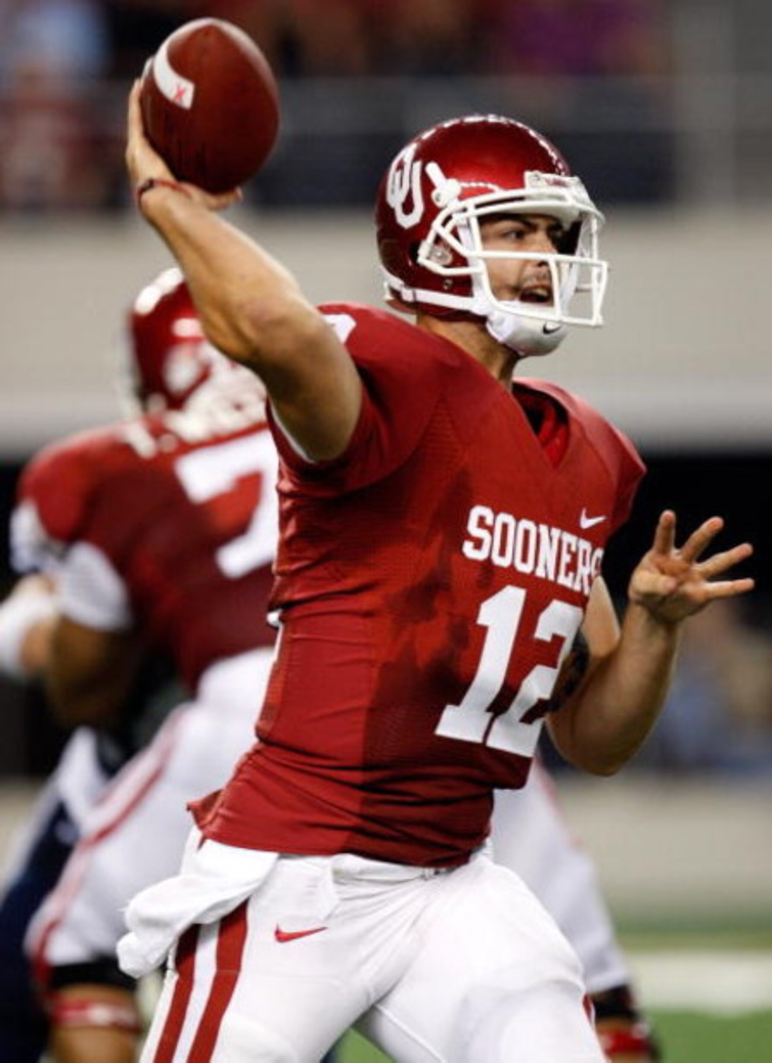 ARLINGTON, TX - SEPTEMBER 05:  Quarterback Landry Jones #12 of the Oklahoma Sooners at Cowboys Stadium on September 5, 2009 in Arlington, Texas.  (Photo by Ronald Martinez/Getty Images)