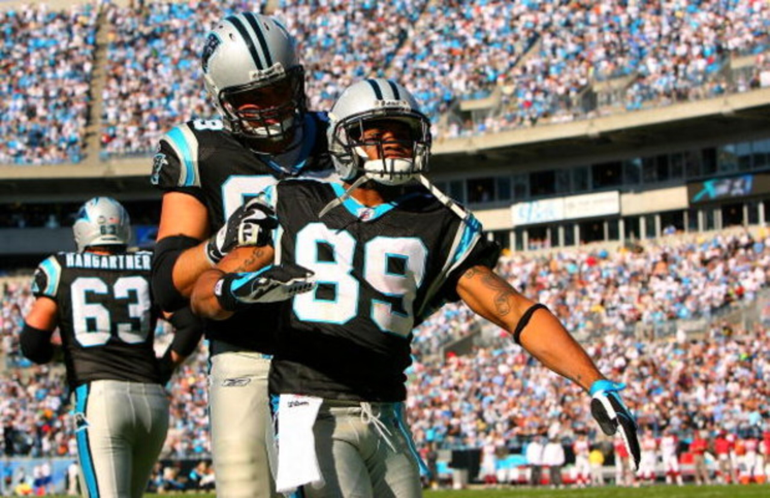 CHARLOTTE, NC - OCTOBER 26:  Steve Smith #89 of the Carolina Panthers and teammate Jordan Gross #69 celebrate after a touchdown against the Arizona Cardinals during their game  on October 26, 2008 at Bank of America Stadium in Charlotte, North Carolina.  