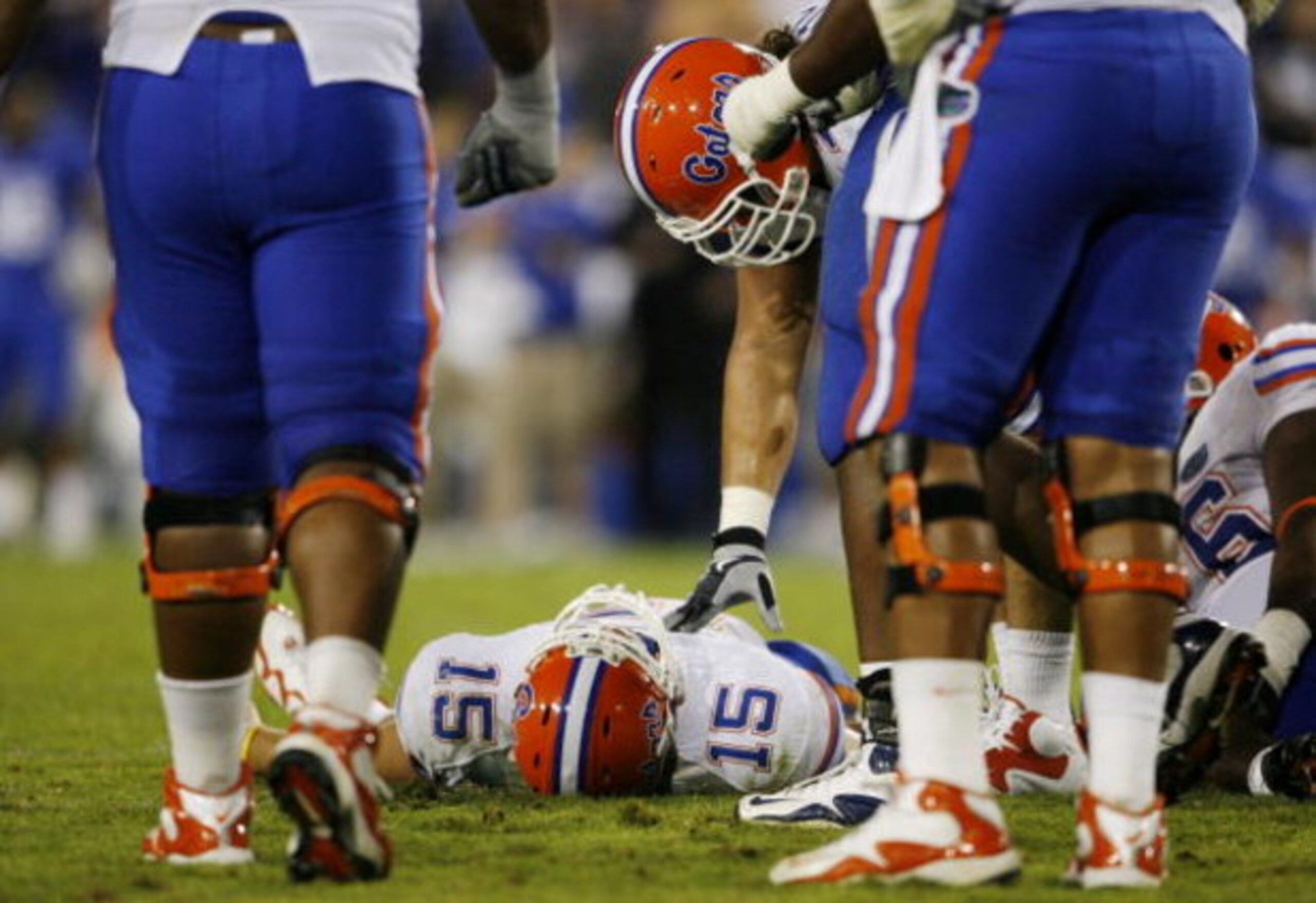 LEXINGTON, KY - SEPTEMBER 26: Quarterback Tim Tebow #15 of the Florida Gators lays on the ground after being sacked by Taylor Wyndham #94 of the Kentucky Wildcats during the third quarter of the game at Commonwealth Stadium on September 26, 2009 in Lexing