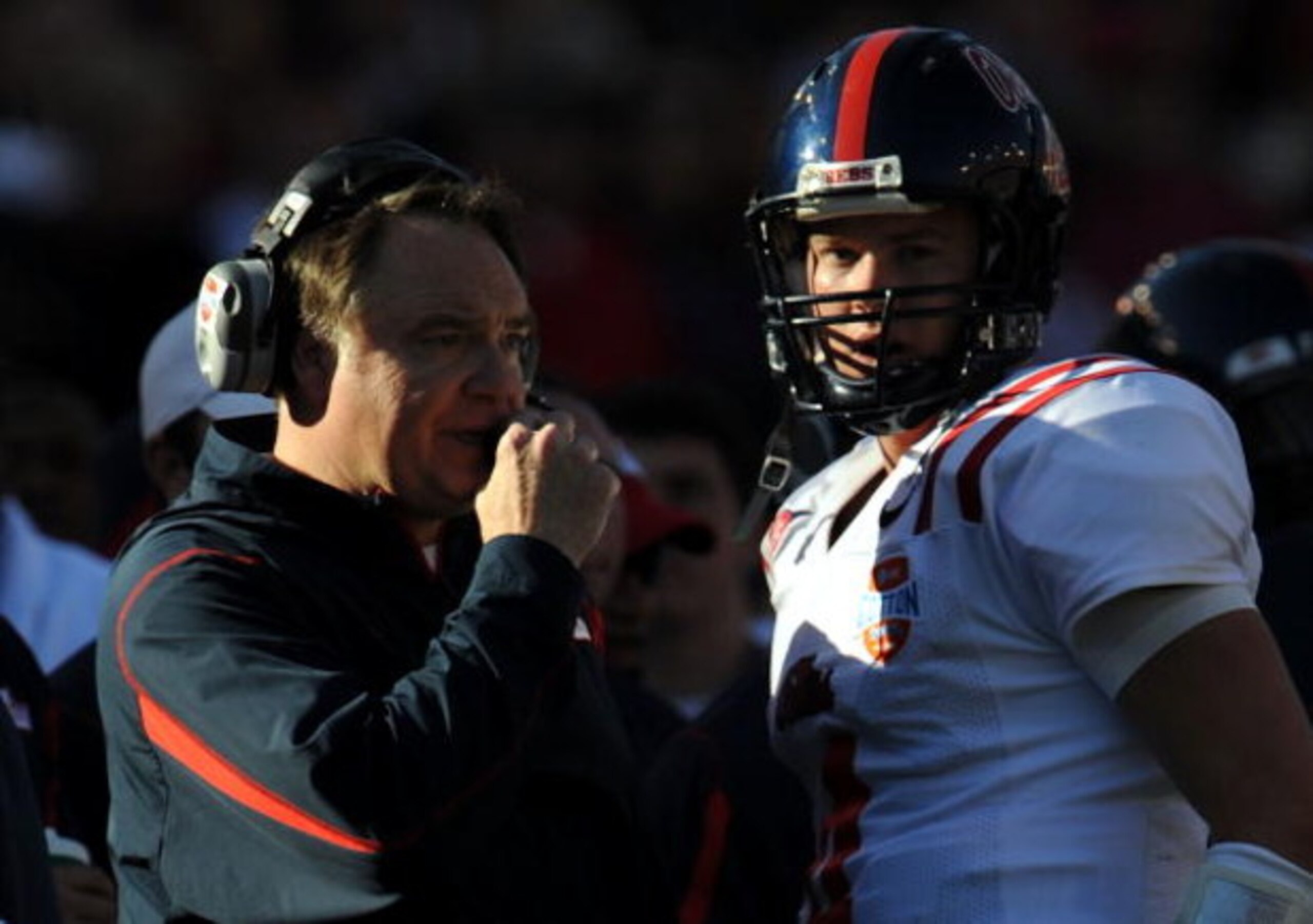 DALLAS - JANUARY 02:  Head coach Houston Nutt talks with Jevan Snead #4 of the Mississippi Rebels between downs against the Texas Tech Red Raiders during the AT&T Cotton Bowl on January 2, 2009 at the Cotton Bowl in Dallas, Texas.  (Photo by Ronald Martin