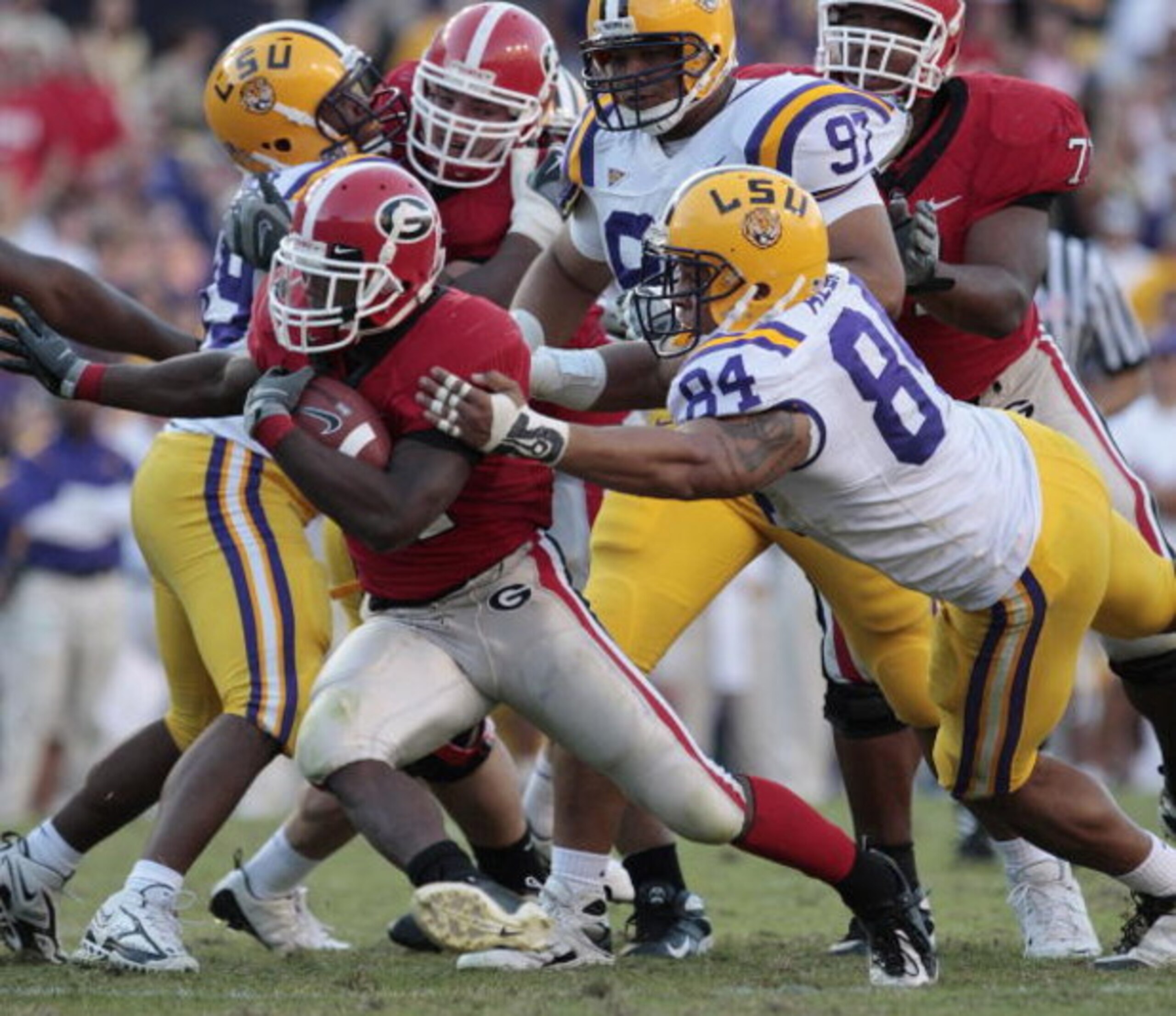 BATON ROUGE, LA - OCTOBER 25:  Knowshon Moreno #24 of Georgia outruns the tackle of Rahim Alem #84 in the second half of their football game at Tiger Stadium on October 25, 2008 in Baton Rouge, Louisiana.  Georgia won 52-38. (Photo by Dave Martin/Getty Im