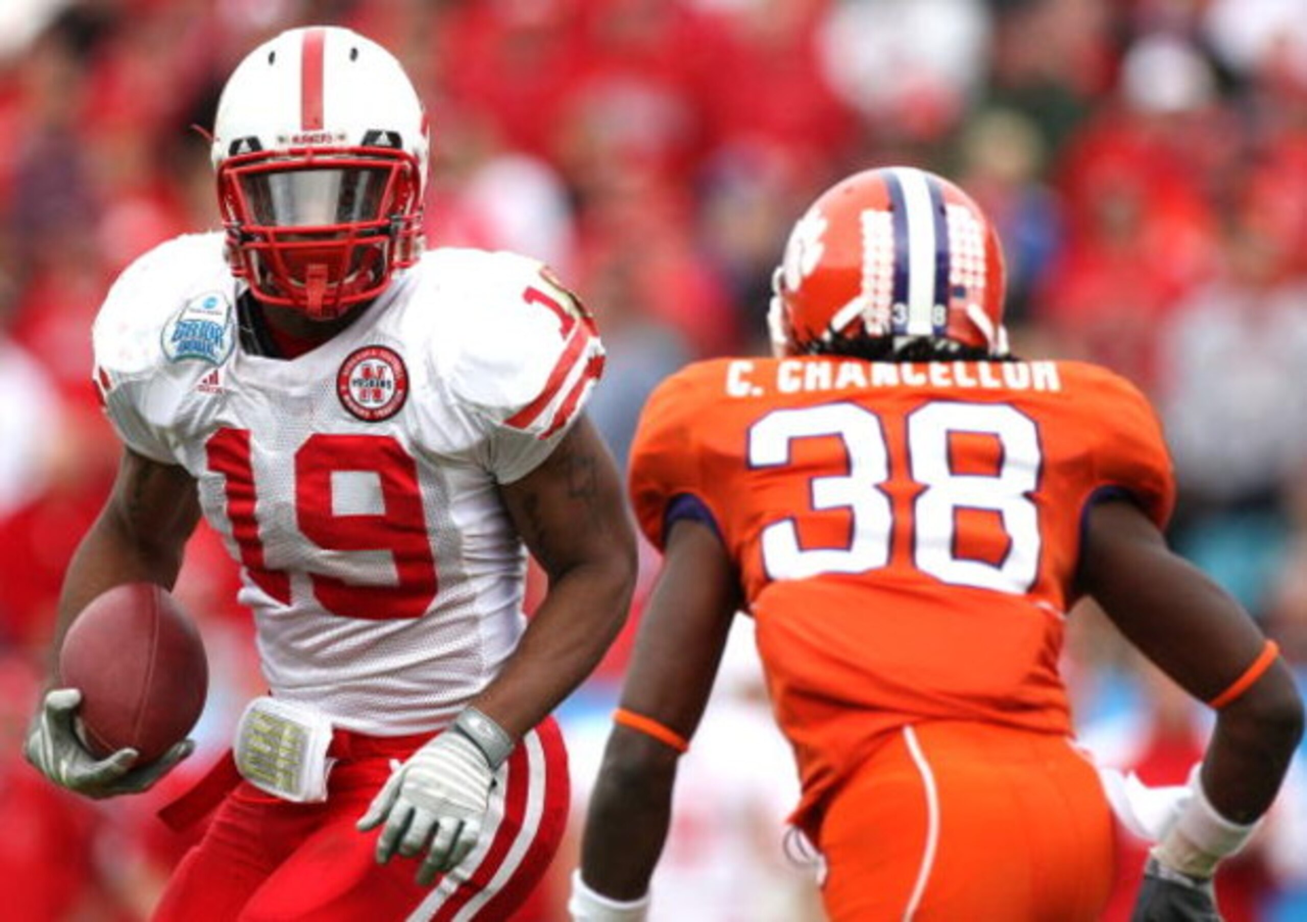 JACKSONVILLE, FL - JANUARY 1:  Quentin Castille #19 of the Nebraska Cornhuskers attempts to allude the tackle of Chris Chancellor #38 of the Clemson Tigers during the Konica Minolta Gator Bowl at Jacksonville Municipal Stadium January 1, 2009 in Jacksonvi