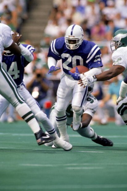 1987:  Albert Bentley #20 of the Indianapolis Colts looks for room to run against the Philadelphia Eagles during a 1987 NFL game.  (Photo by Doug Pensinger/Getty Images)