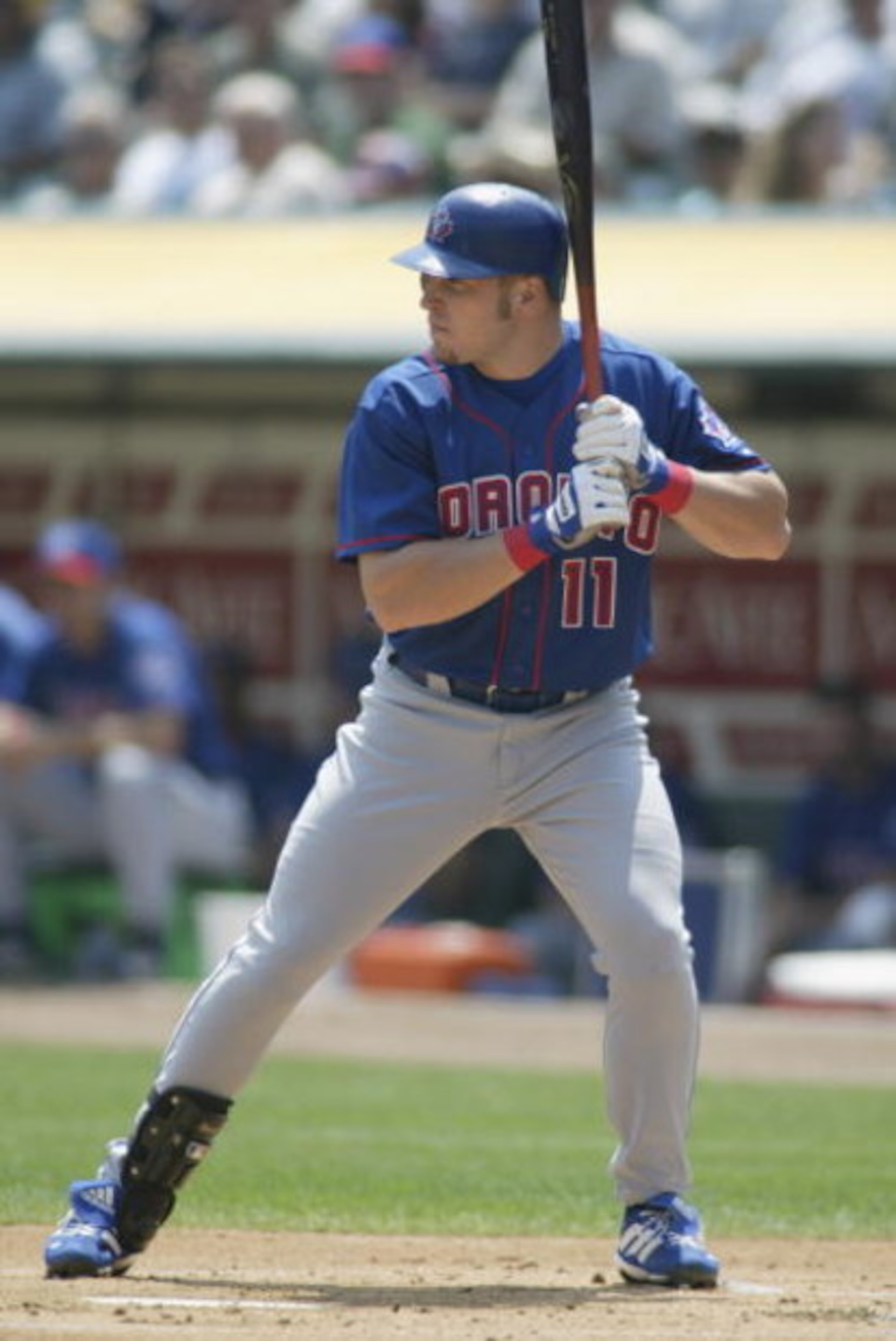 OAKLAND, CA - AUGUST 14:  Third Baseman Eric Hinske #11 of the Toronto Blue Jays readies at the plate against the Oakland A's at the Network Associates Coliseum on August 14, 2002 in Oakland, California.  The A's defeated the Blue Jays 4-2.  (Photo by Jed