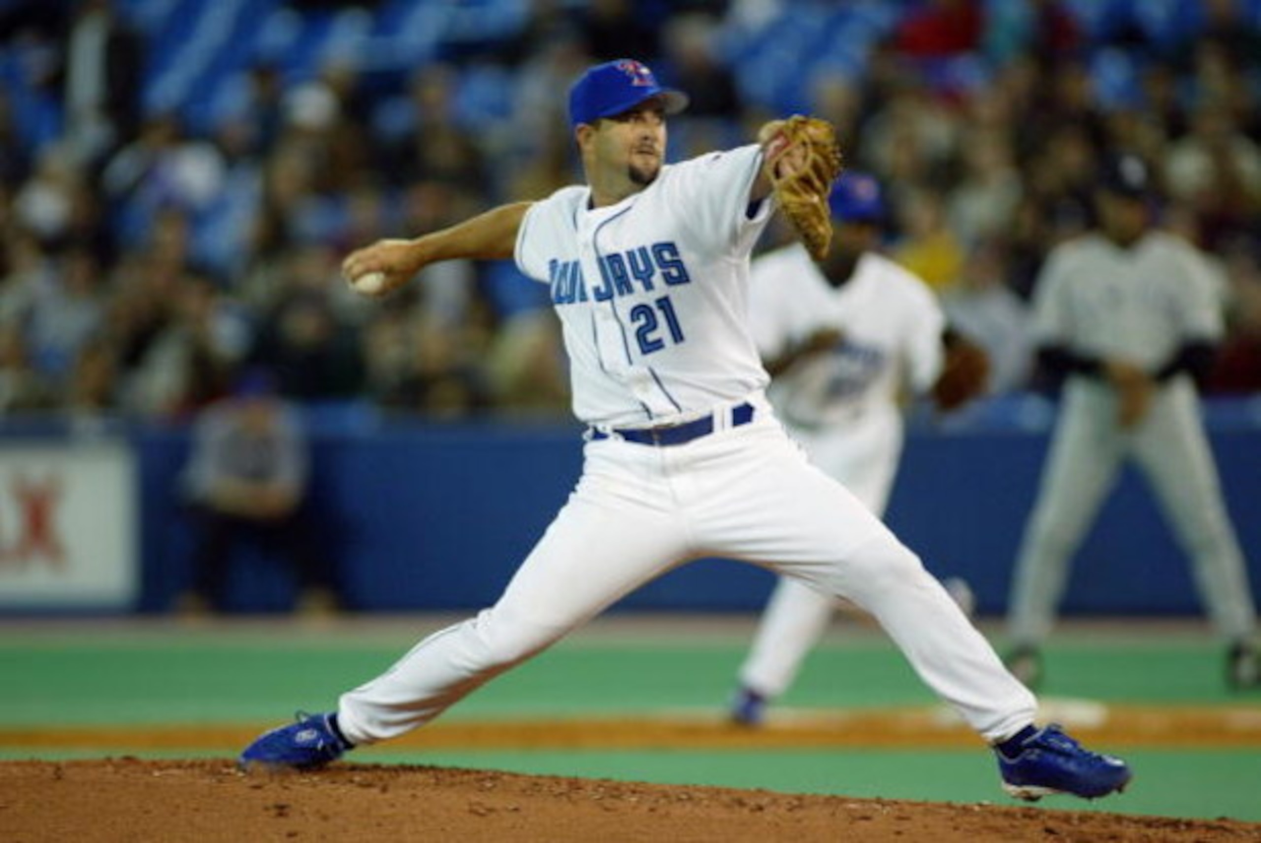 TORONTO - APRIL 1:  Pitcher Cory Lidle #21 of the Toronto Blue Jays throws against the New York Yankees at SkyDome on April 1, 2003 in Toronto, Canada.  The Yankees defeated the Blue Jays 10-1.  (Photo by Rick Stewart/Getty Images) 