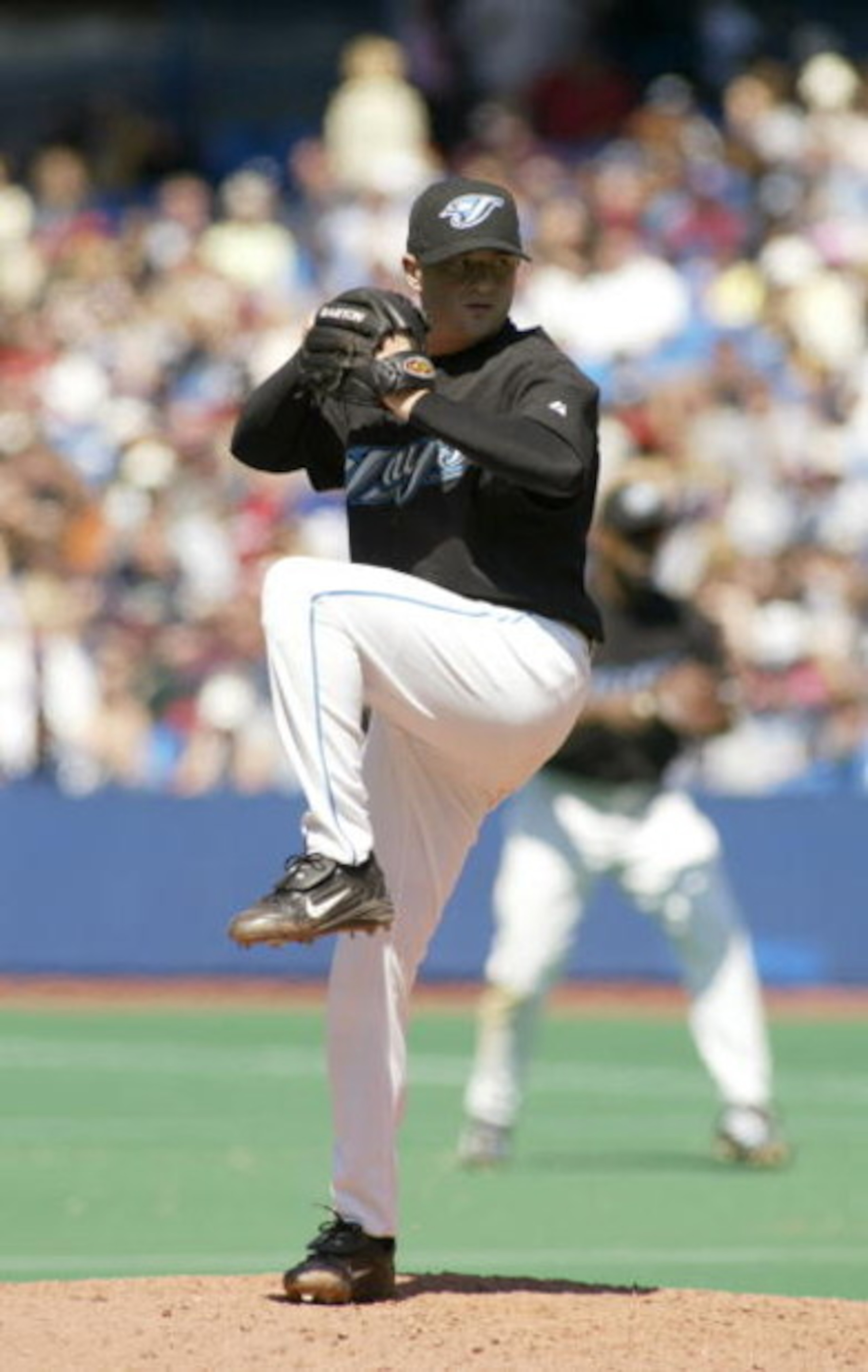 TORONTO - MAY 16:  Jason Frasor #54 of the Toronto Blue Jays pitches against the Boston Red Sox during the game on May 16, 2004 at Skydome in Toronto, Ontario, Canada.  The Blue Jays won 3-1.  (Photo by Rick Stewart/Getty Images)