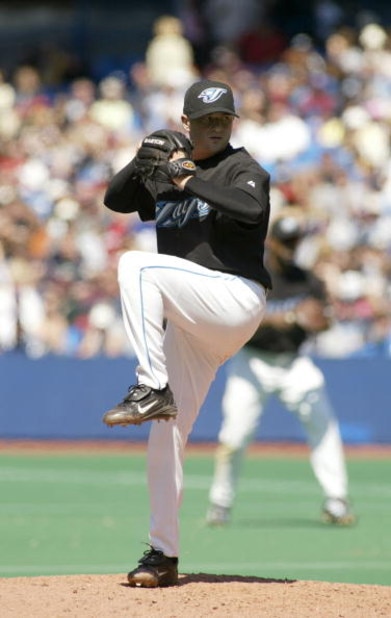 TORONTO - MAY 16:  Jason Frasor #54 of the Toronto Blue Jays pitches against the Boston Red Sox during the game on May 16, 2004 at Skydome in Toronto, Ontario, Canada.  The Blue Jays won 3-1.  (Photo by Rick Stewart/Getty Images)