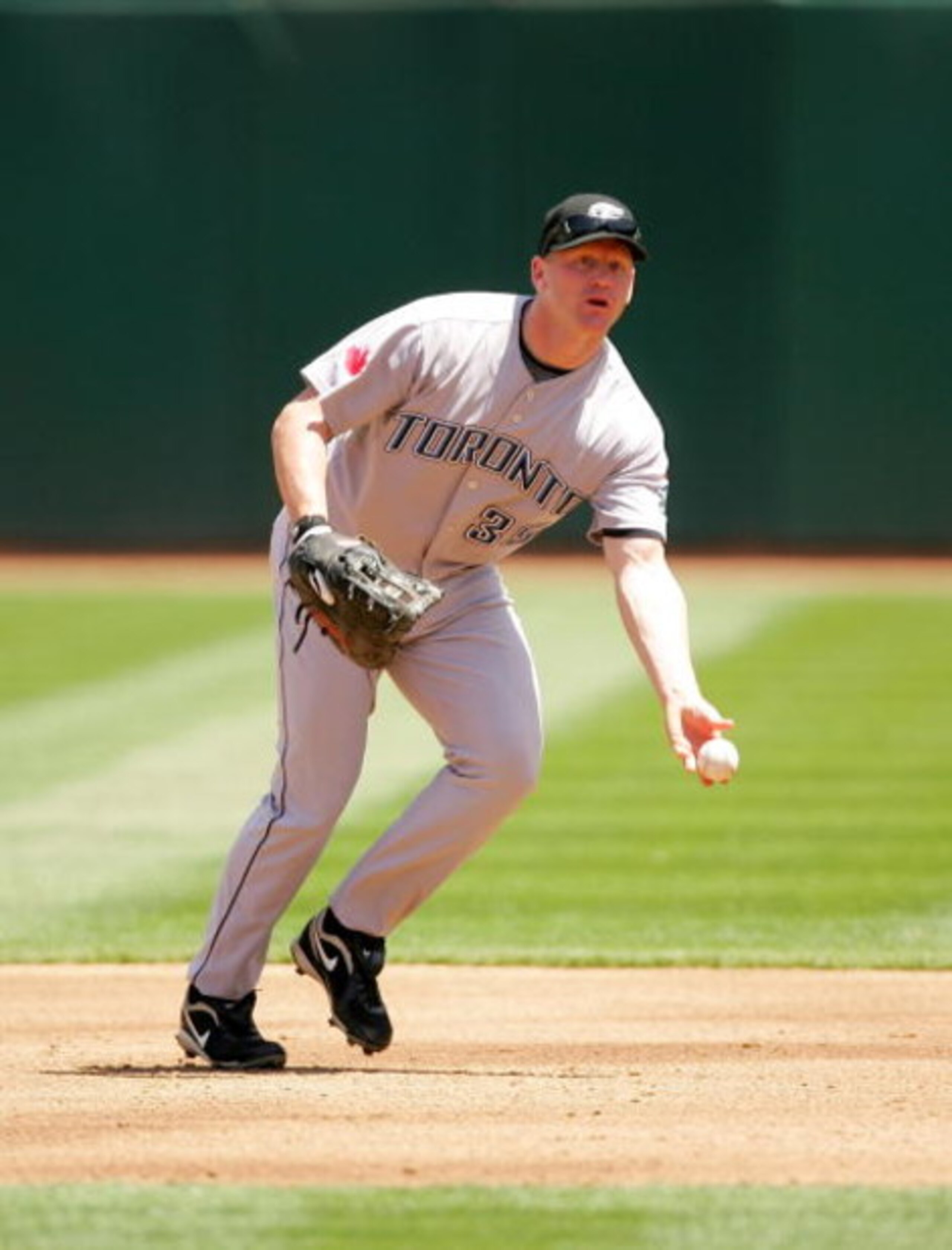 OAKLAND, CA - MAY 09:  Lyle Overbay #35 of the Toronto Blue Jays tosses the ball to first base during their game against the Oakland Athletics on May 9, 2009 at the Oakland Coliseum in Oakland, California.  (Photo by Ezra Shaw/Getty Images)