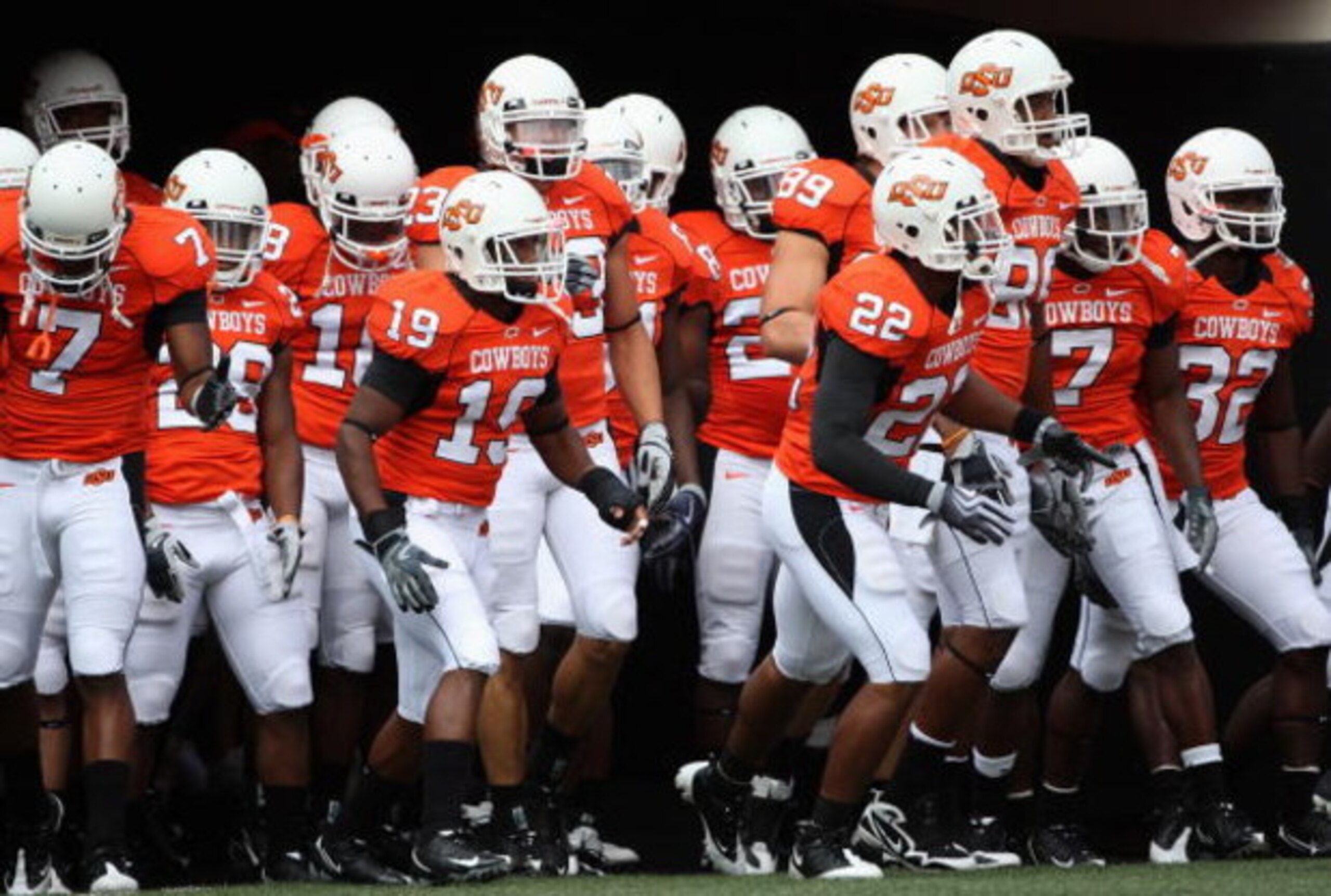 STILLWATER, OK - SEPTEMBER 05: The Oklahoma State Cowboys run out onto the field before the college football game at Boone Pickens Stadium on September 5, 2009 in Stillwater, Oklahoma. The Cowboys defeated the Bulldogs 24-10. (Photo by Christian Peters STILLWATER, OK - SEPTEMBER 05: The Oklahoma State Cowboys run out onto the field before the college football game at Boone Pickens Stadium on September 5, 2009 in Stillwater, Oklahoma. The Cowboys defeated the Bulldogs 24-10. (Photo by Christian Peters