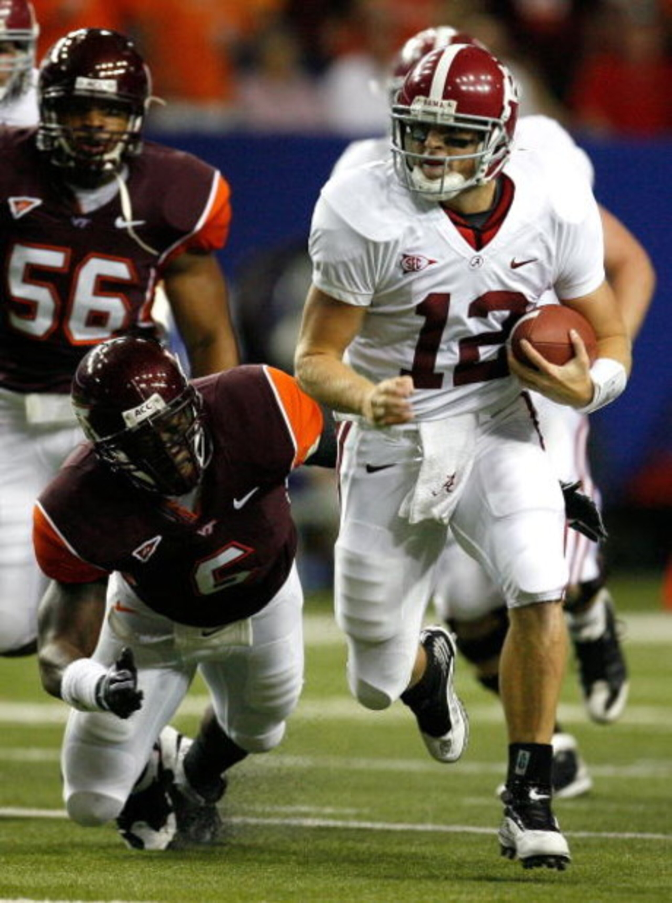 ATLANTA - SEPTEMBER 05: Quarterback Greg McElroy #12 of the Alabama Crimson Tide rushes away from Jason Worilds #6 of the Virginia Tech Hokies during the Chick-fil-A Kickoff Game at Georgia Dome on September 5, 2009 in Atlanta, Georgia. (Photo by Kevin ATLANTA - SEPTEMBER 05: Quarterback Greg McElroy #12 of the Alabama Crimson Tide rushes away from Jason Worilds #6 of the Virginia Tech Hokies during the Chick-fil-A Kickoff Game at Georgia Dome on September 5, 2009 in Atlanta, Georgia. (Photo by Kevin