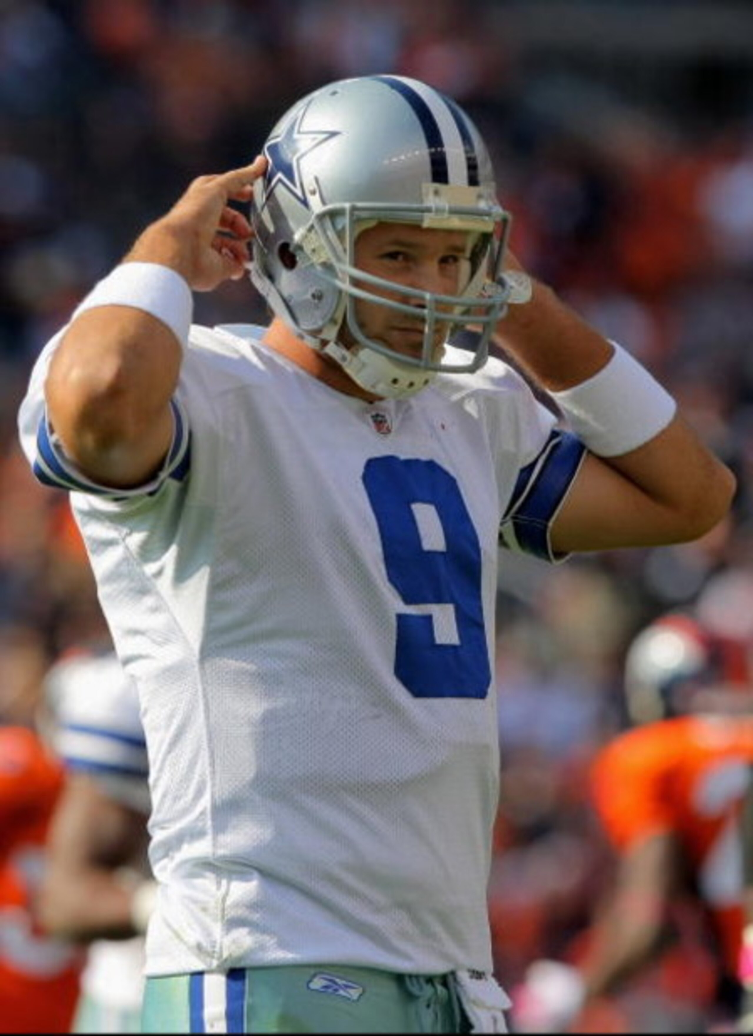 DENVER - OCTOBER 04:  Quarterback Tony Romo #9 of the Dallas Cowboys walks to the bench after failing to convert a third down against the Denver Broncos during NFL action at Invesco Field at Mile High on October 4, 2009 in Denver, Colorado. The Broncos de