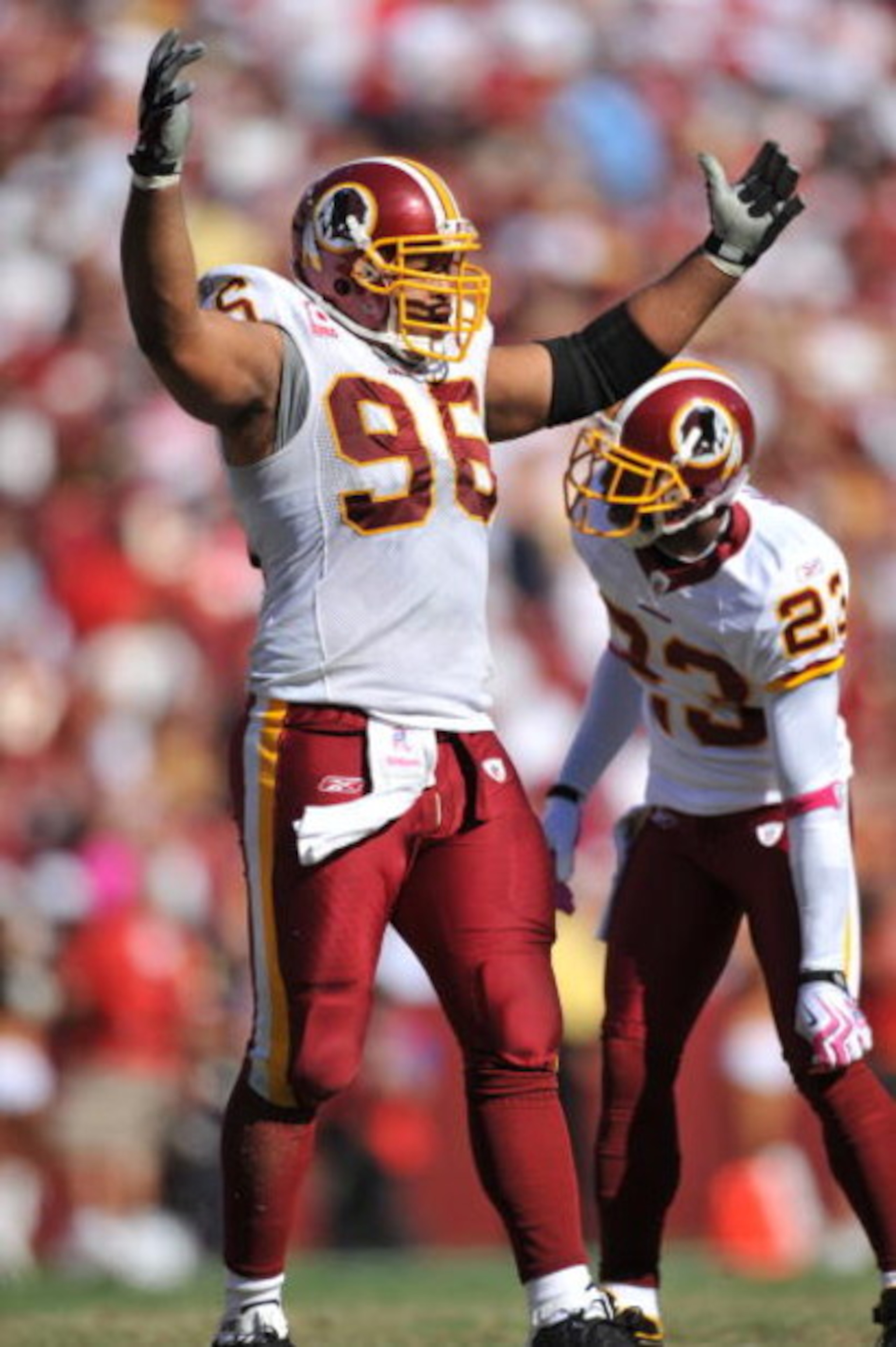 LANDOVER, MD - OCTOBER 4:  Cornelius Griffin #96 of the Washington Redskins rouses the crowd against the Tampa Bay Buccaneers at FedExField on October 4, 2009 in Landover, Maryland. The Redskins defeated the Buccaneers 16-13. (Photo by Larry French/Getty 