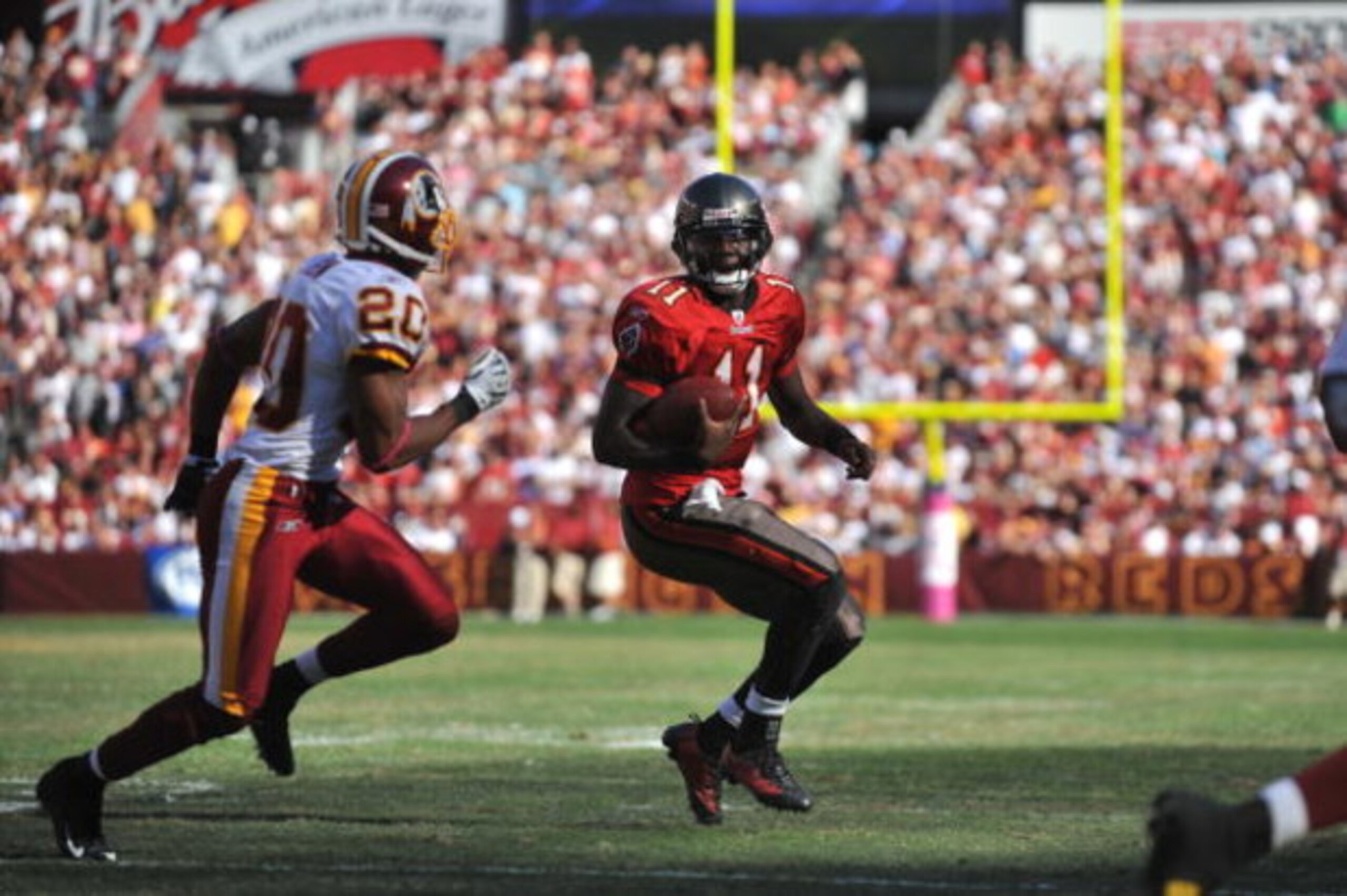 LANDOVER, MD - OCTOBER 4:  Josh Johnson #11 of the Tampa Bay Buccaneers runs the ball against the Washington Redskins at FedExField on October 4, 2009 in Landover, Maryland. The Redskins defeated the Buccaneers 16-13. (Photo by Larry French/Getty Images)